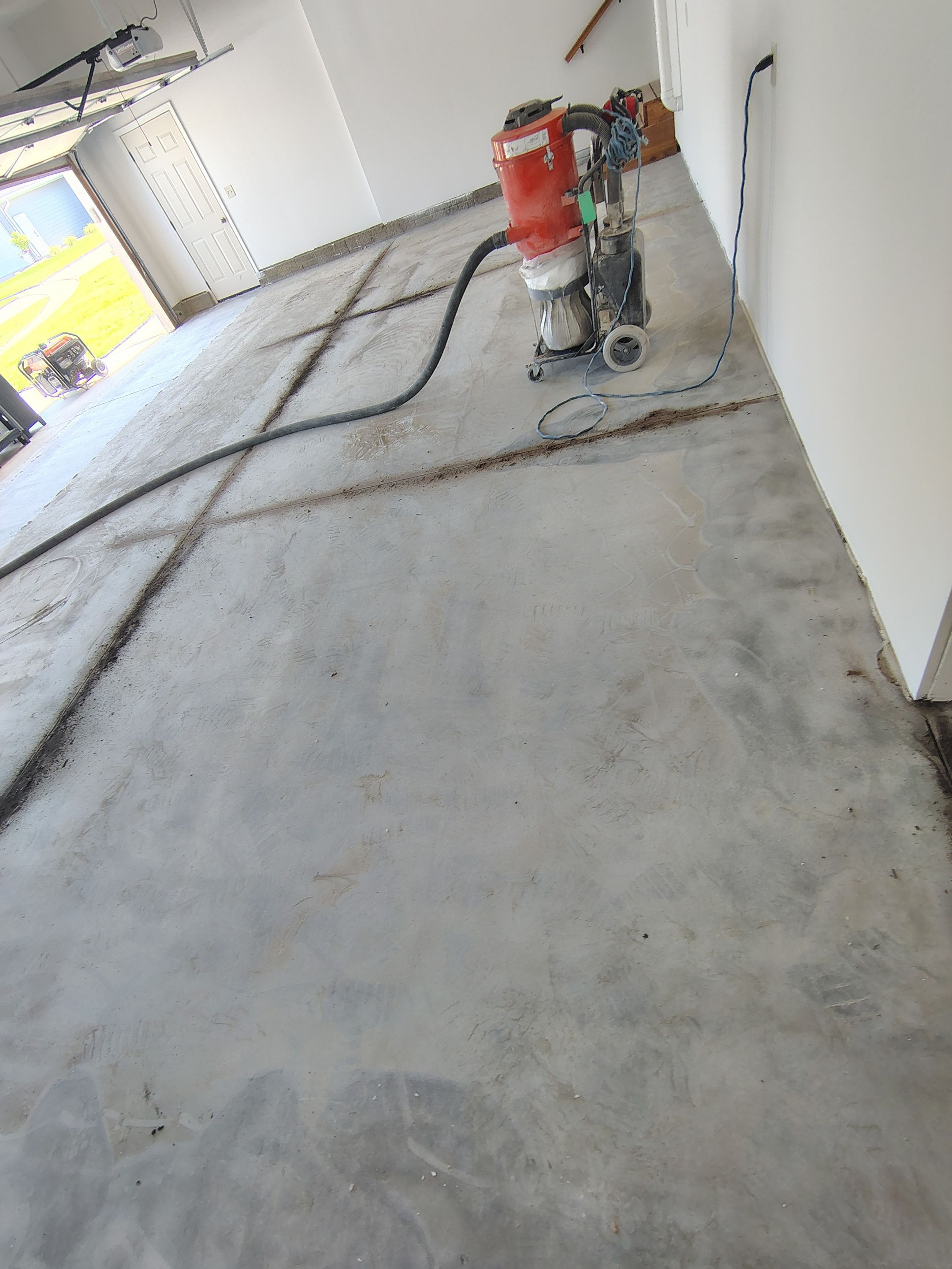 Custom Grey Speckled Epoxy Floor Coating for Sioux Falls Garage by Select Painting, Coatings & Garage Cabinets