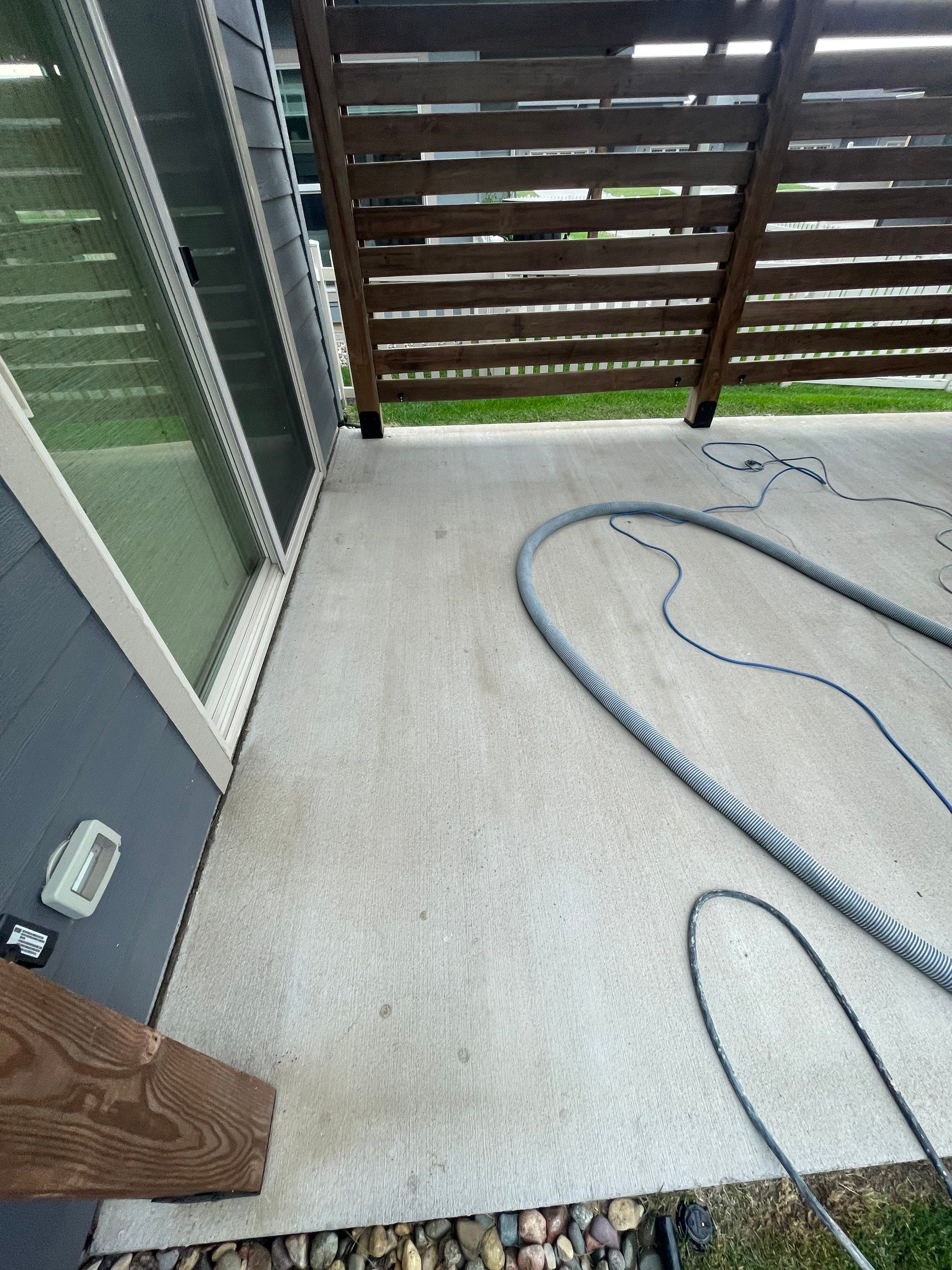 Textured Concrete Patio Coating and Custom Privacy Pergola in Sioux Falls by Select Painting, Coatings & Garage Cabinets