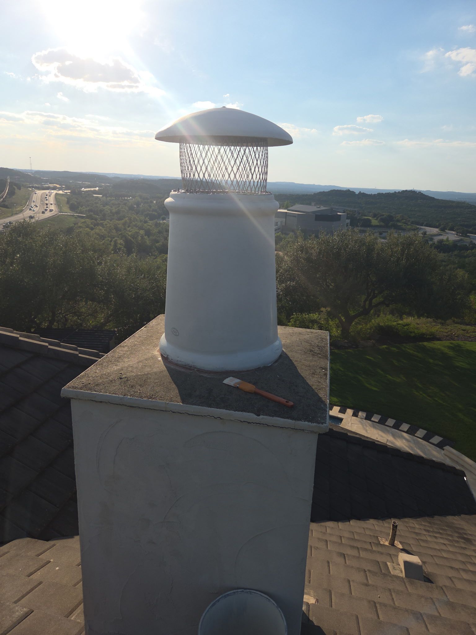 Tile roof and custom chimney cap by REPS Austin Area Roofer