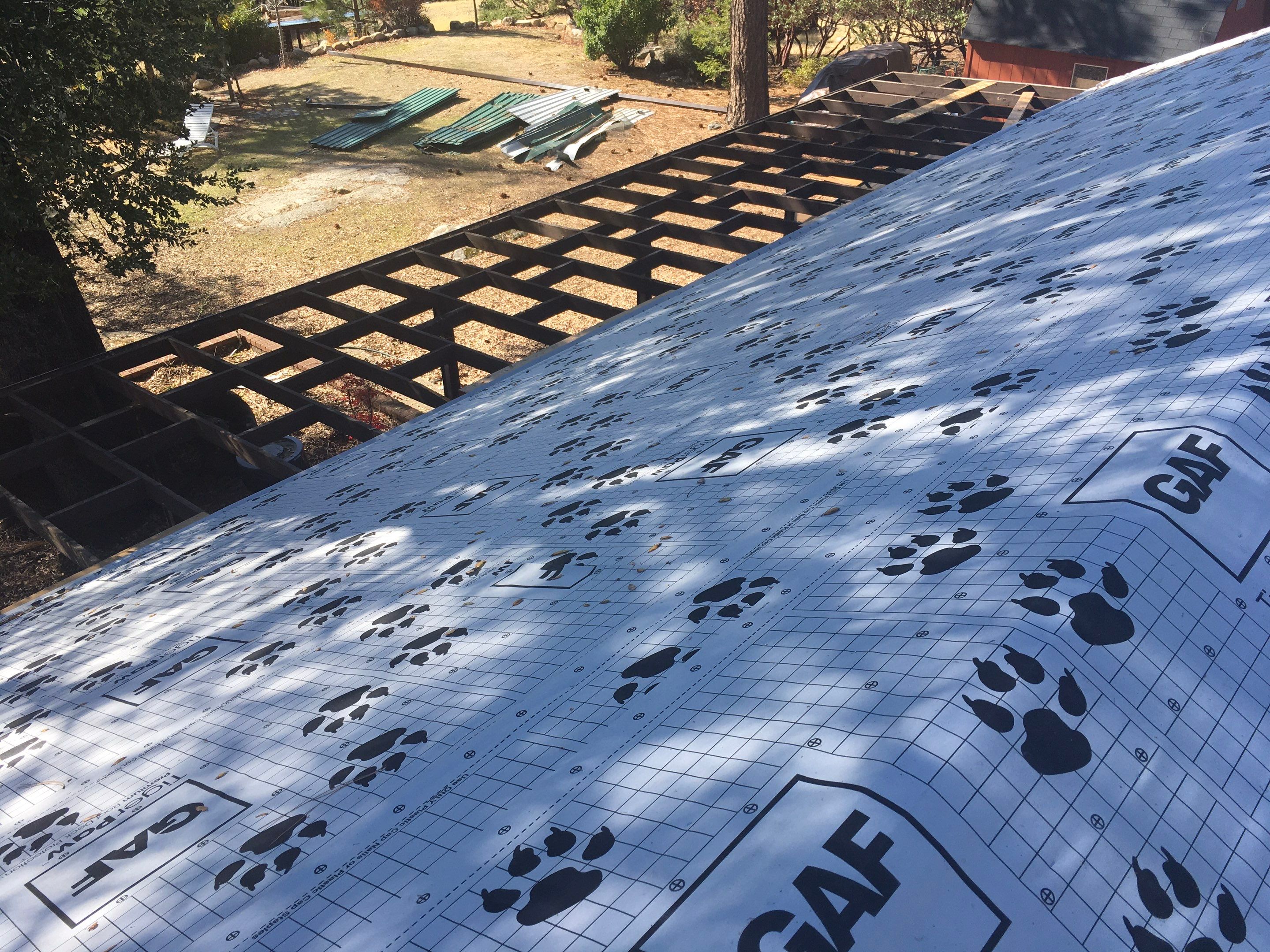 Metal roofing installation using Standing seam metal roofing system by Straight Edge Roofing Inc