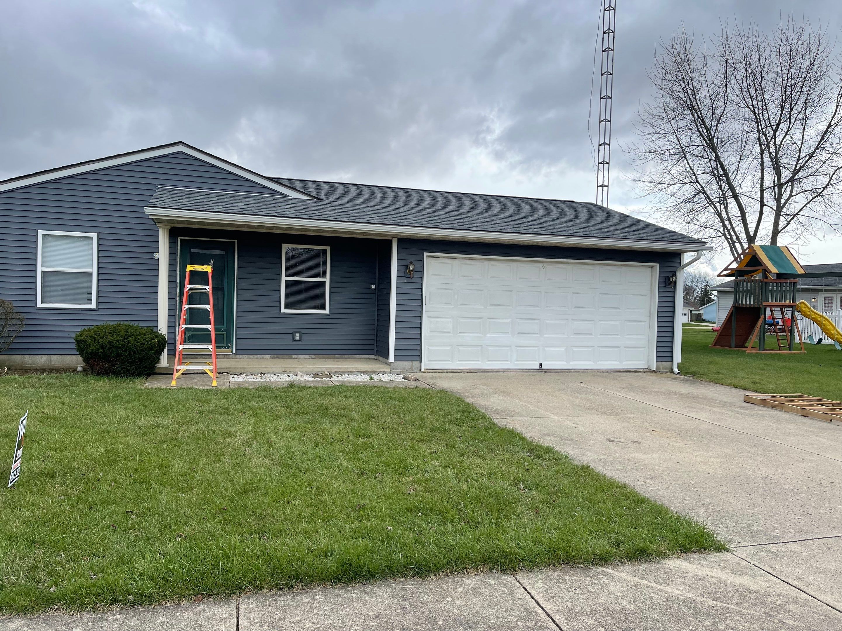 Storm Damage Residential Roof and Siding Installation by WIW Enterprises Inc