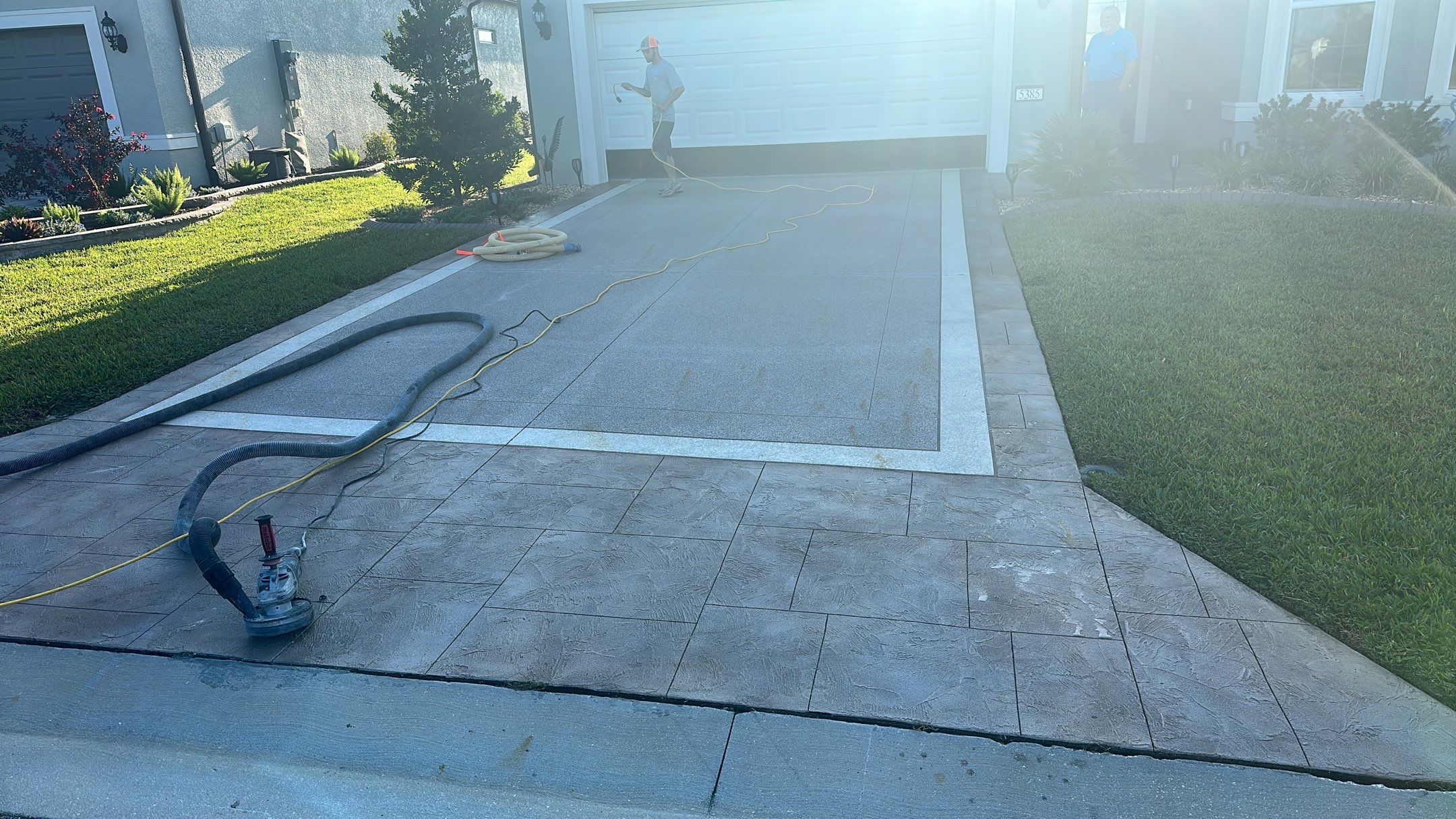 Driveway and Sidewalk in Slatestone with Silvercreek Border by Innovative Concrete Coatings 