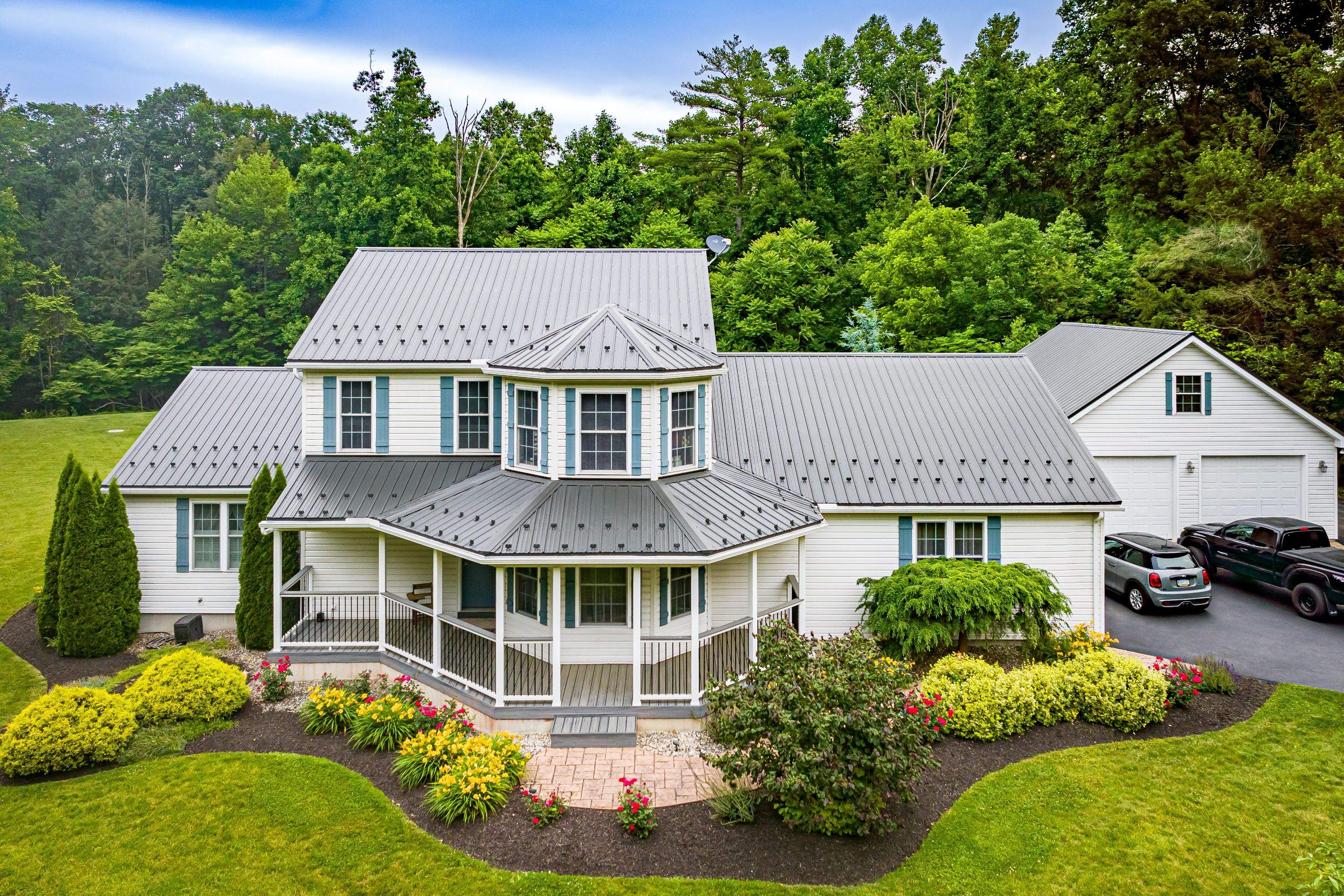 Metal roof install- shadow gray by Esh Builders