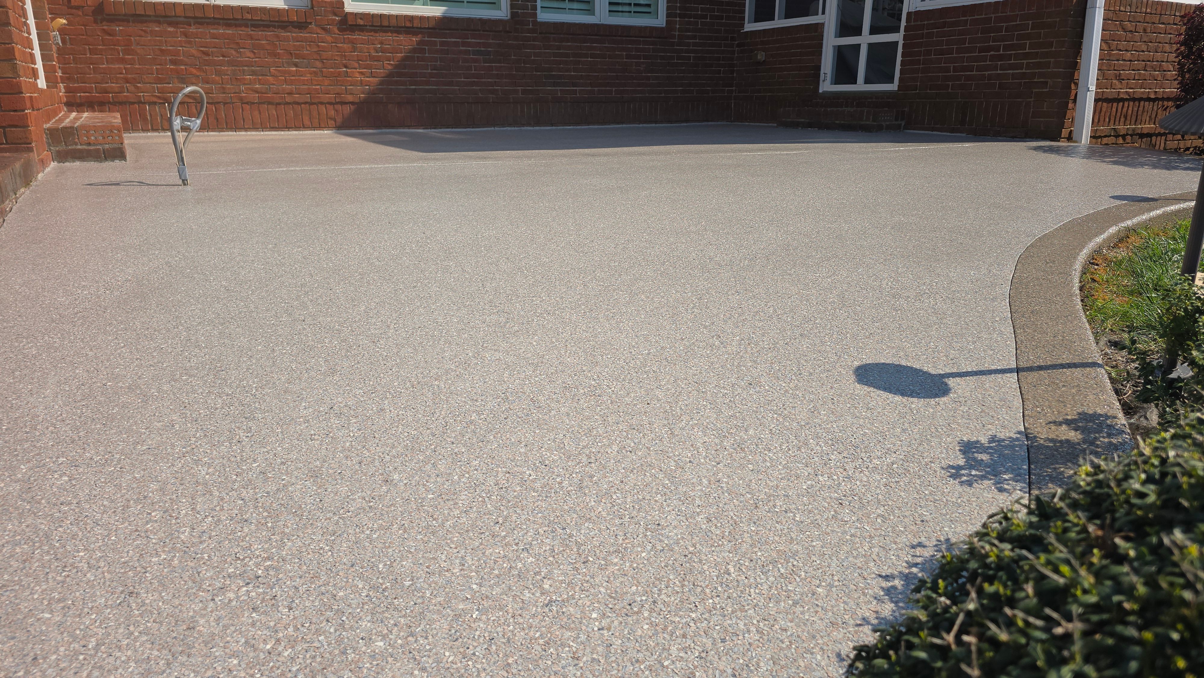 Patio in Pumice with Obsidian Border  by Elite Floor Solutions