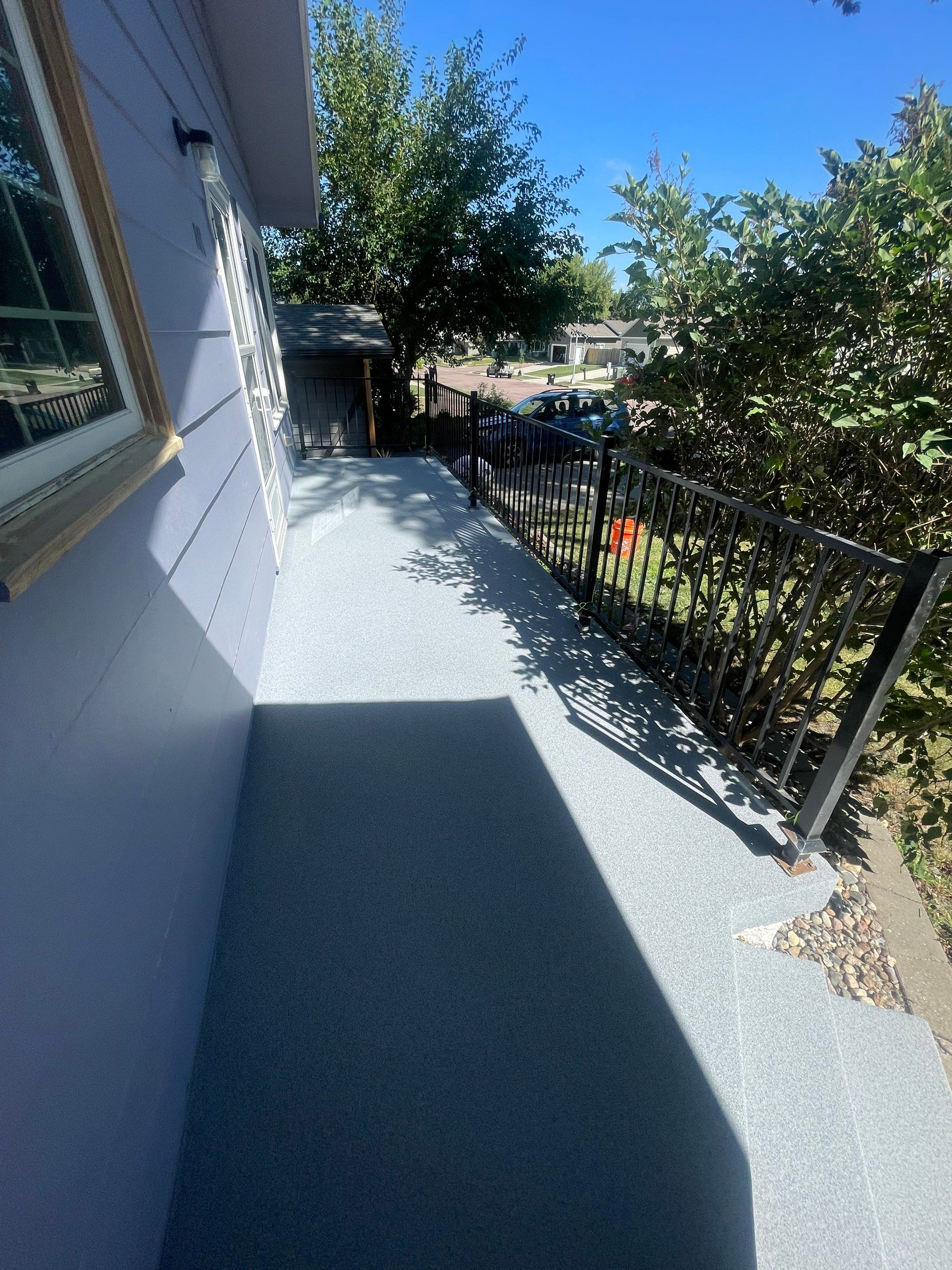 Sioux Falls Concrete Porch Coating with Starry Evening Finish by Select Painting, Coatings & Garage Cabinets