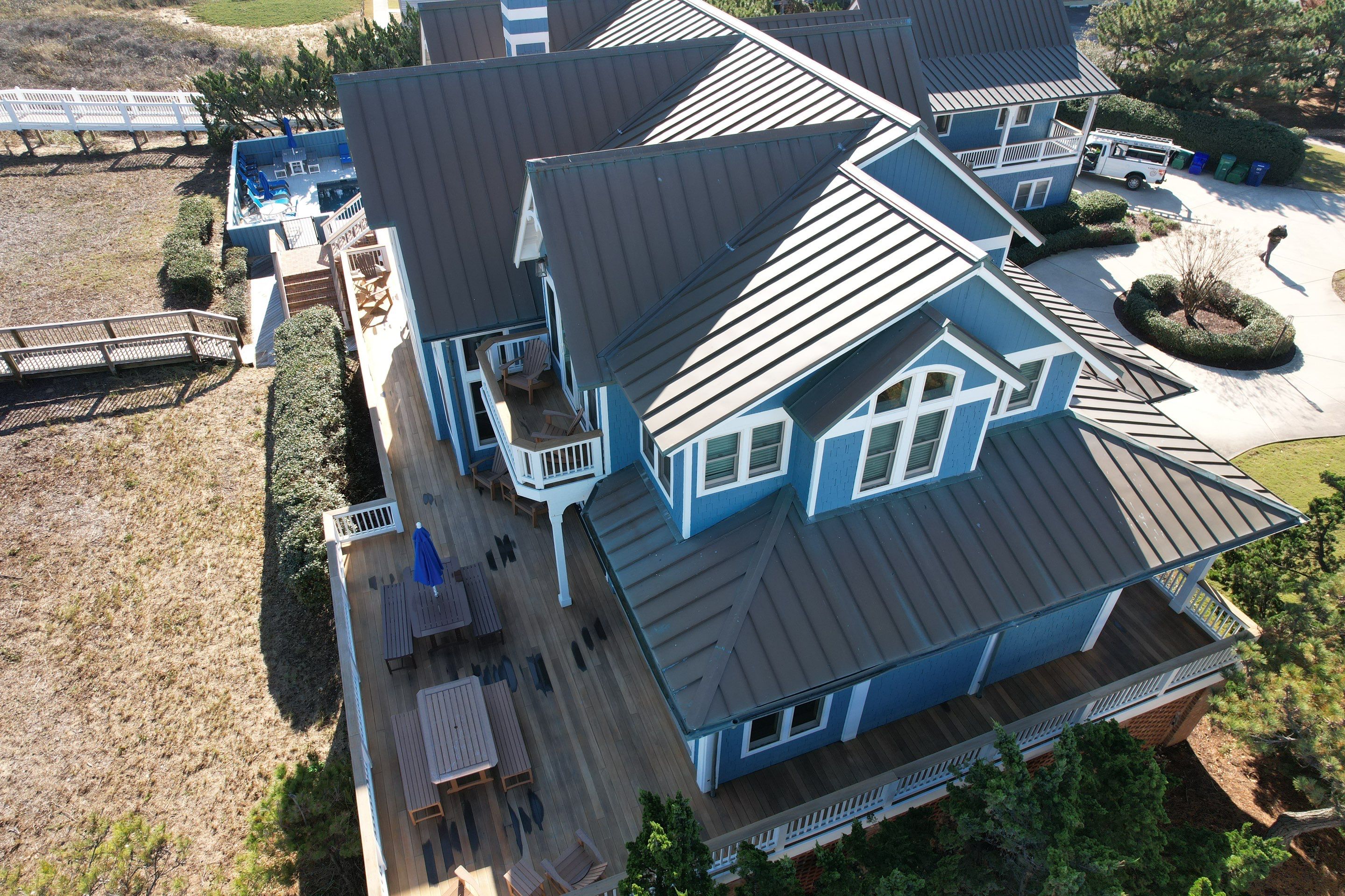 Large Metal Roof Transformation by Gallop Roofing & Remodeling, Inc.