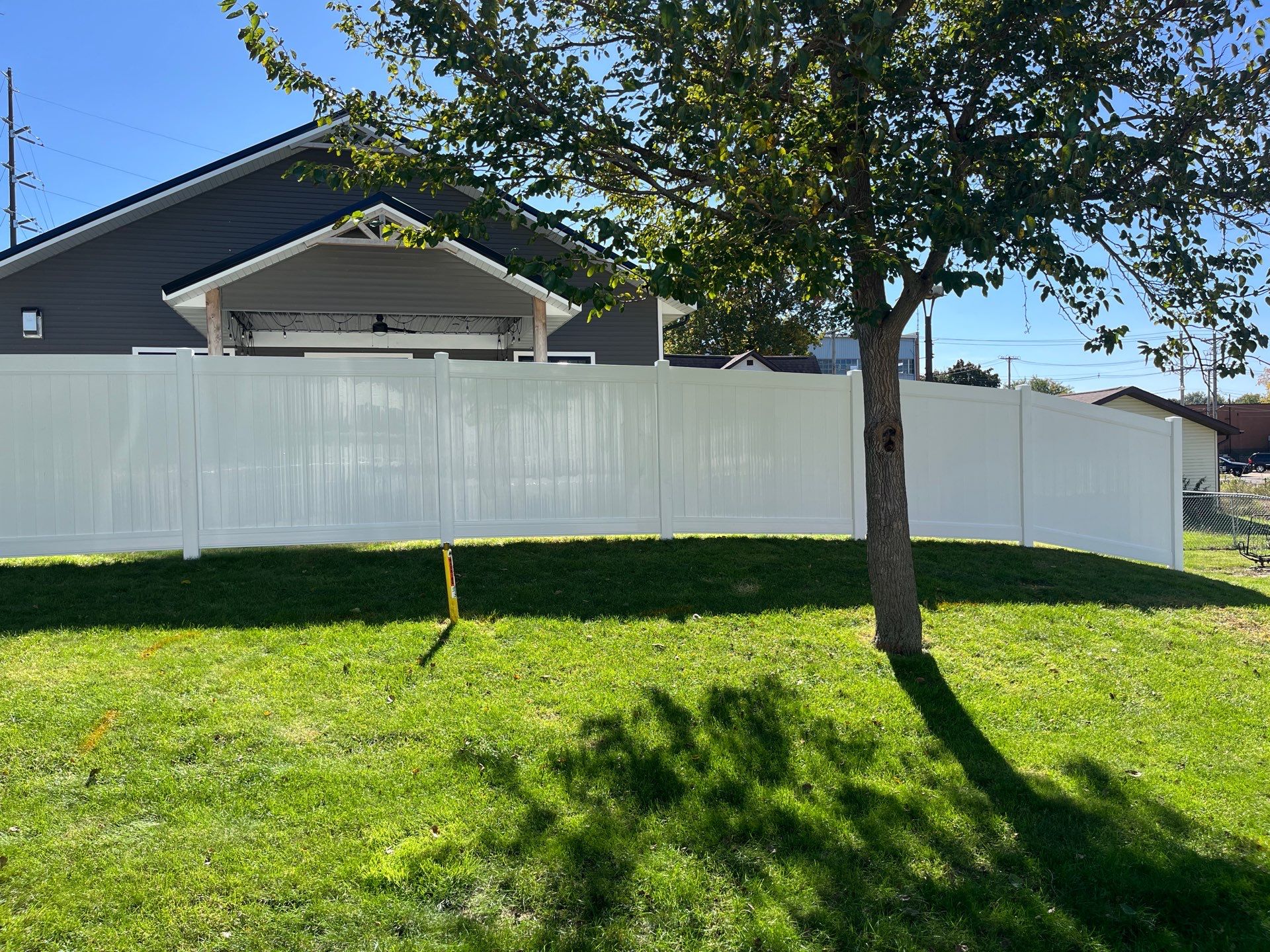 White Vinyl Privacy Fence Installation in Grundy Center by Perfect Picket Fence and Stain