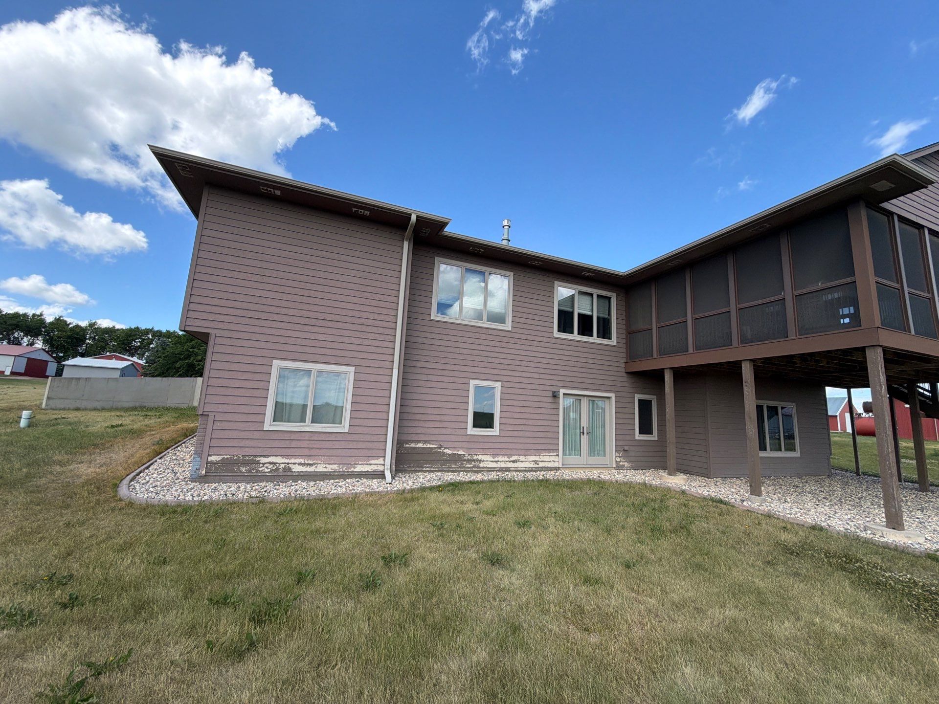Full Exterior Siding Paint Restoration and Refresh in Garretson by Select Painting, Coatings & Garage Cabinets