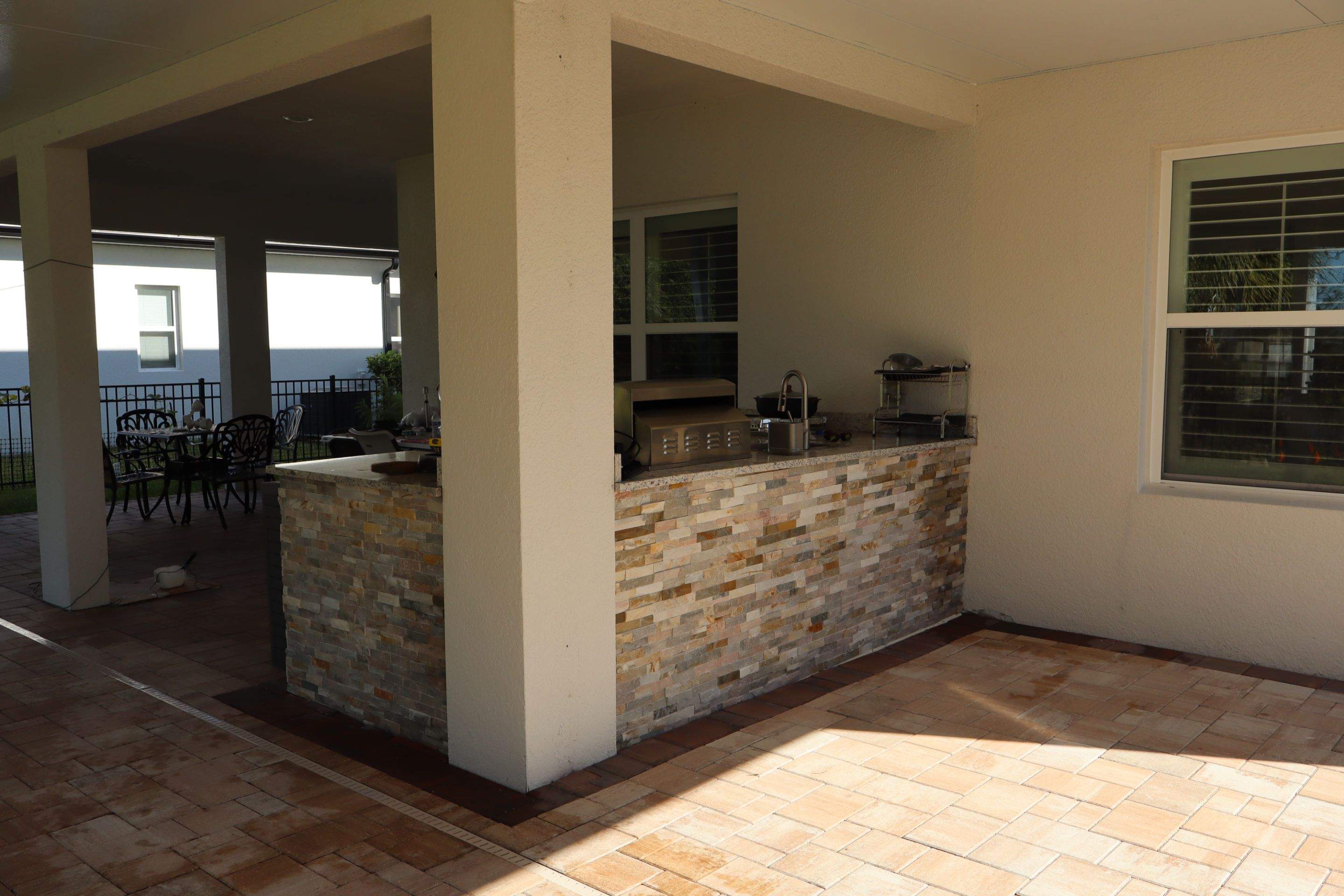 Patio cover with kitchen by Orlando pergolas 