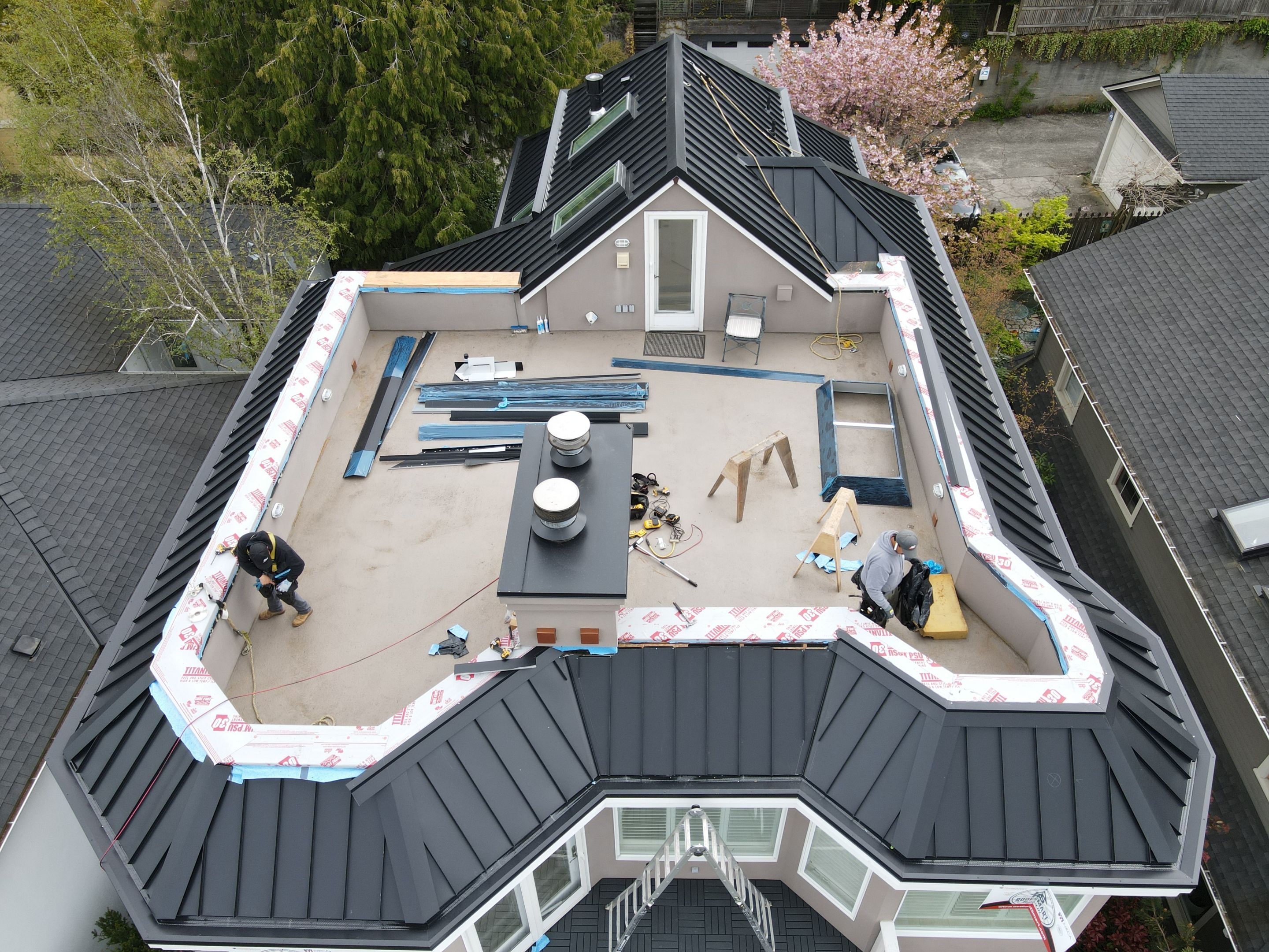 Seattle Queen Anne Rooftop Deck and Roof Replacement using Standing Seam Metal - Black by RoofSmart