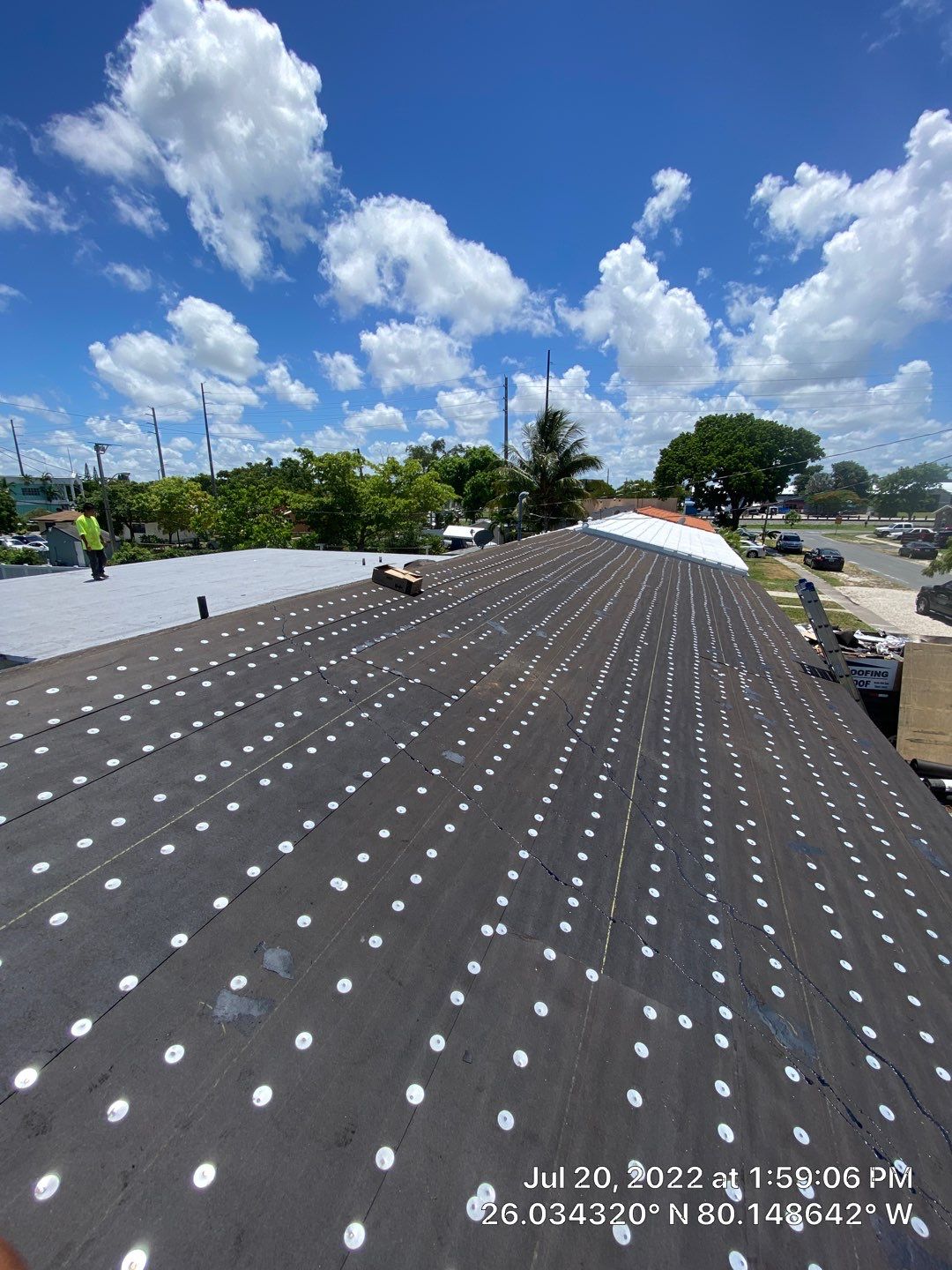 Standing Seam Metal & Flat Re-Roof using 1.5" Nail Strip 24ga Black Matte Kynar Coated Standing Seam Metal Panels by Morton Roofing, Inc.