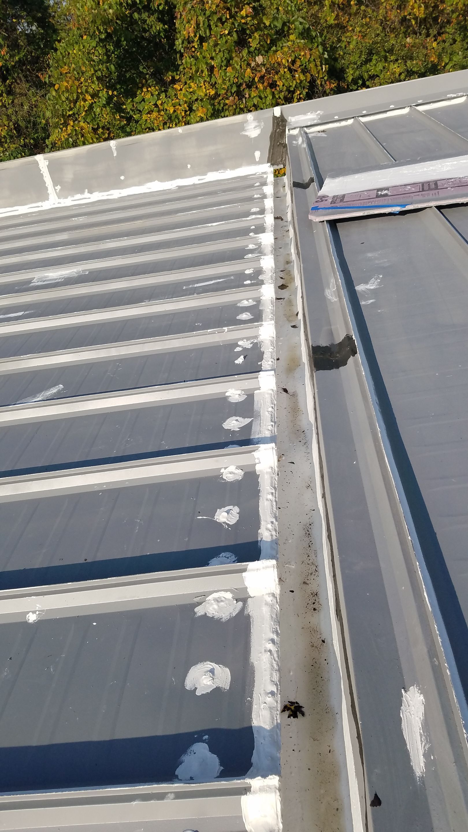 Commercial Metal Roof Coating by Gold Star Roofing LLC