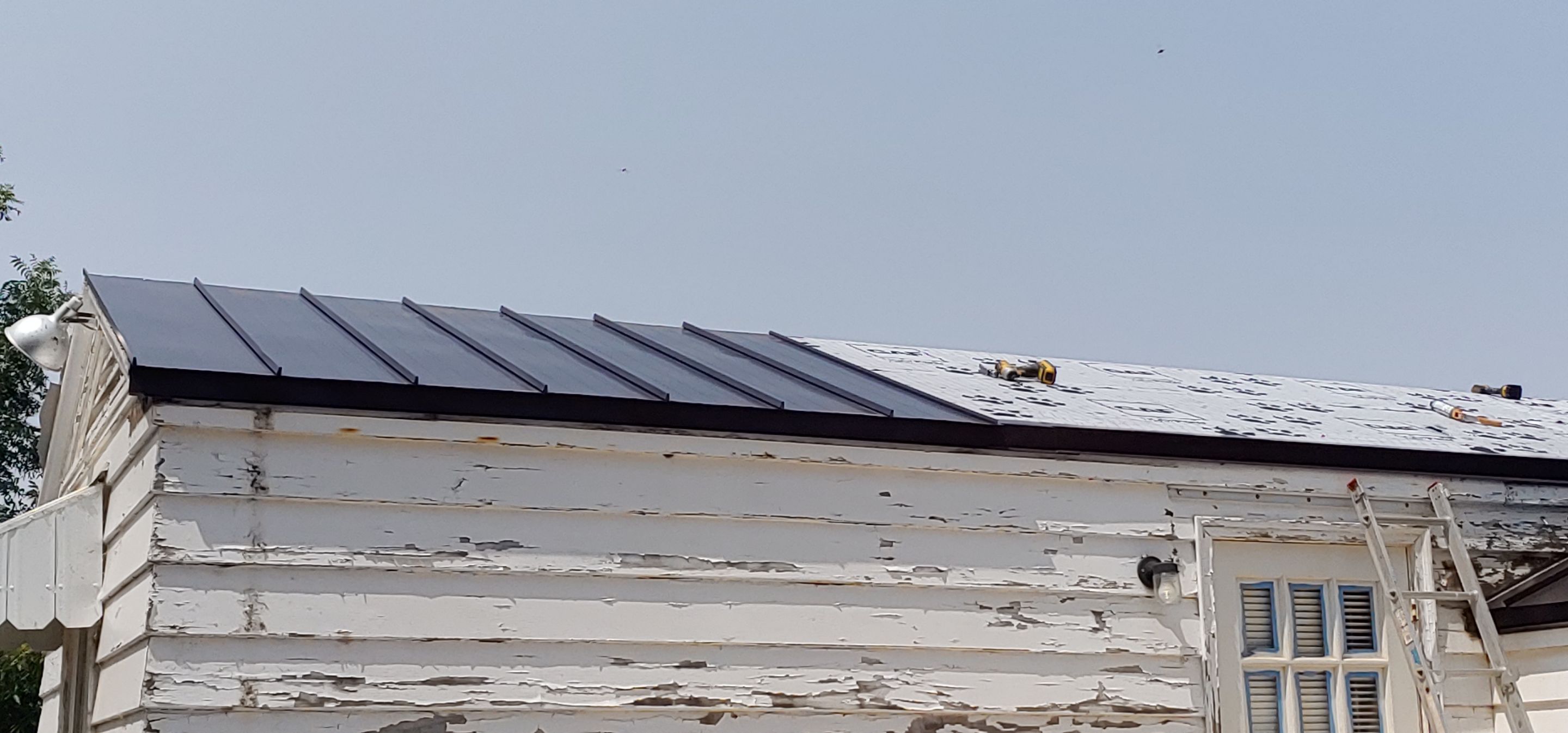 Residential Roofing Installation using Standing seam metal roofing system by Straight Edge Roofing Inc