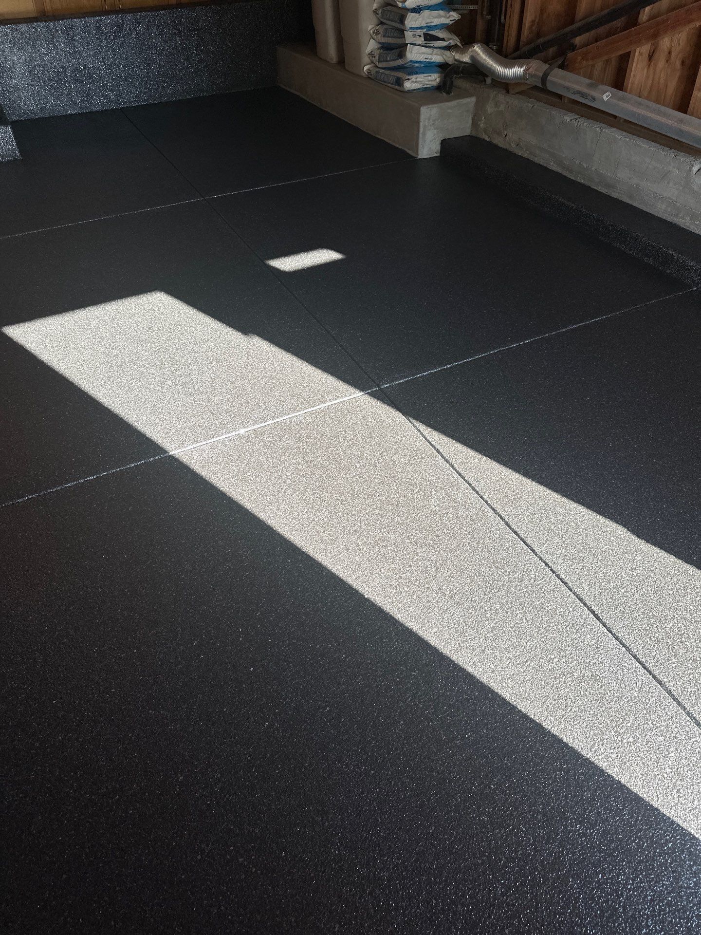 Carbon Chip Polyurea Floor Coating for Paso Robles Basement by MGP Coatings