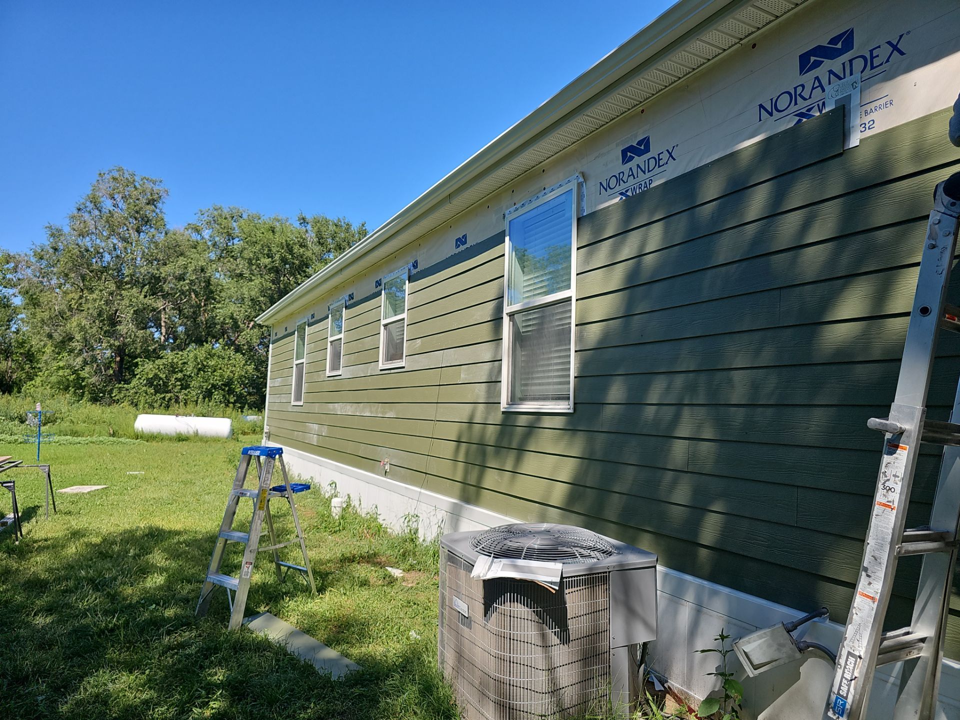 Riverdale Exterior Transformation | TAMKO Roofing & James Hardie Siding by Loyal Nine