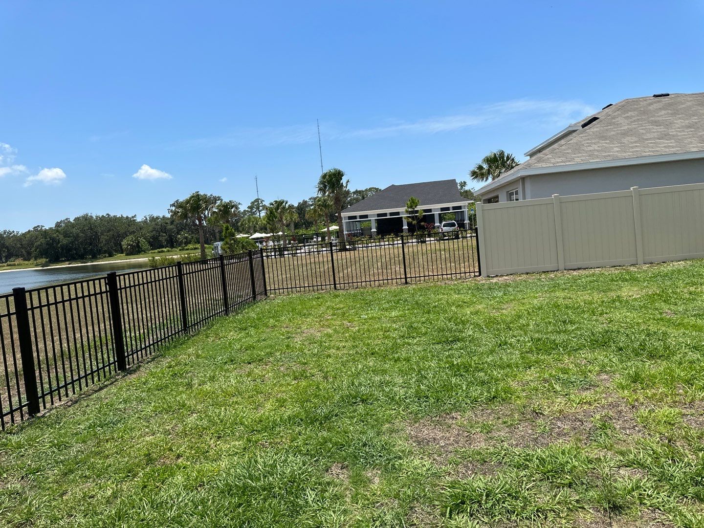 Aluminum Fence Installation using Black 3 Rail Aluminum Fence and Tan Vinyl Privacy Fence by Asap fence and gates, LLC