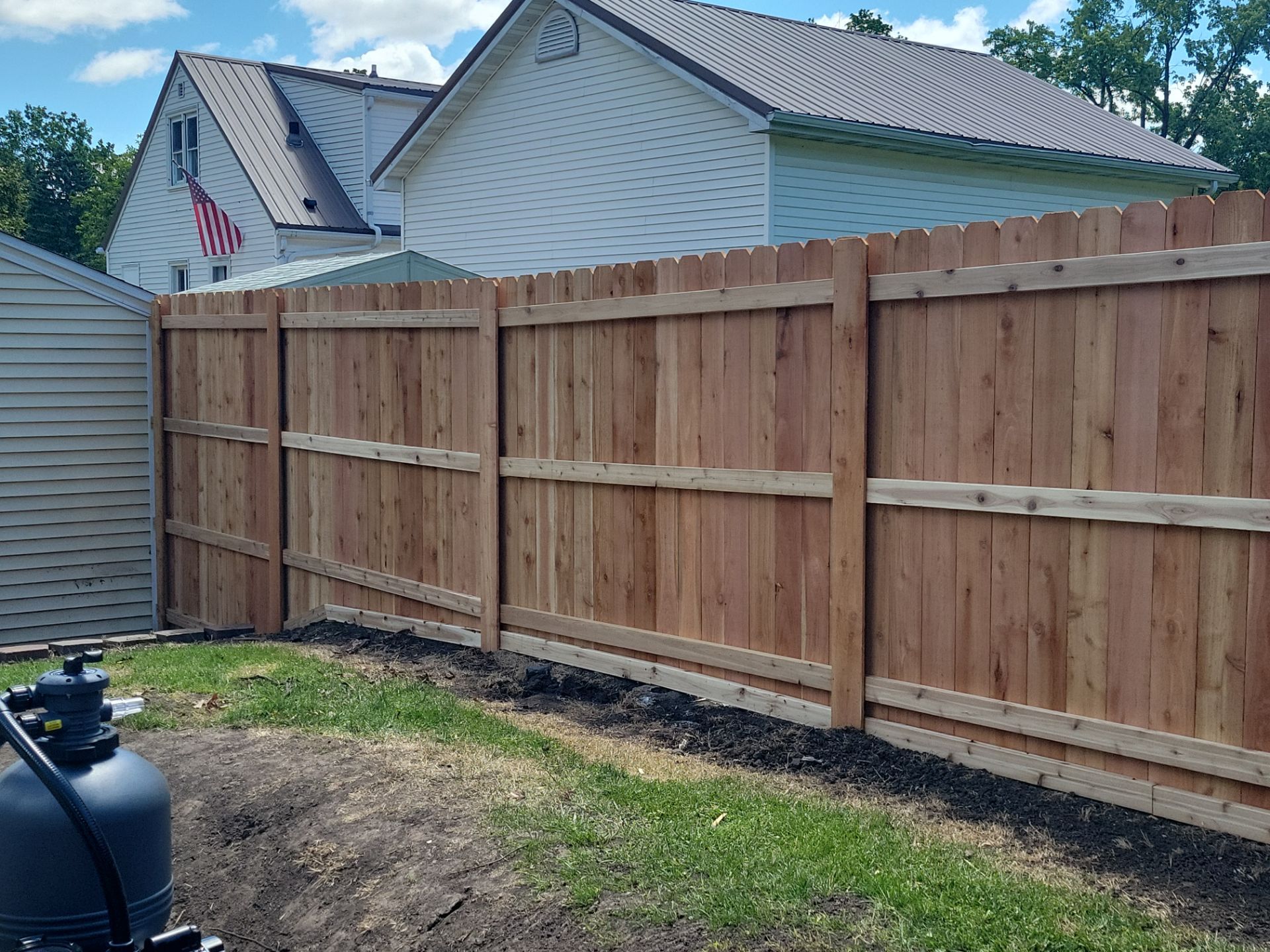 Custom Cedar Unstained Wood Privacy Fence Installation in Cedar Falls by Perfect Picket Fence and Stain