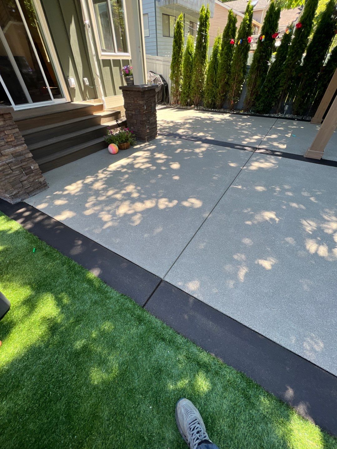 Patio Installation using Concrete, Retaining walls, and Turf install by Jireh Asphalt & Concrete Inc 