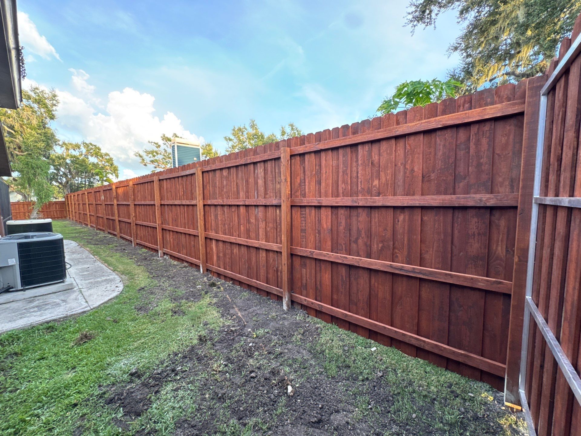 Wood Fence Installation using Pre-stained Pine Board On Board by Asap fence and gates, LLC