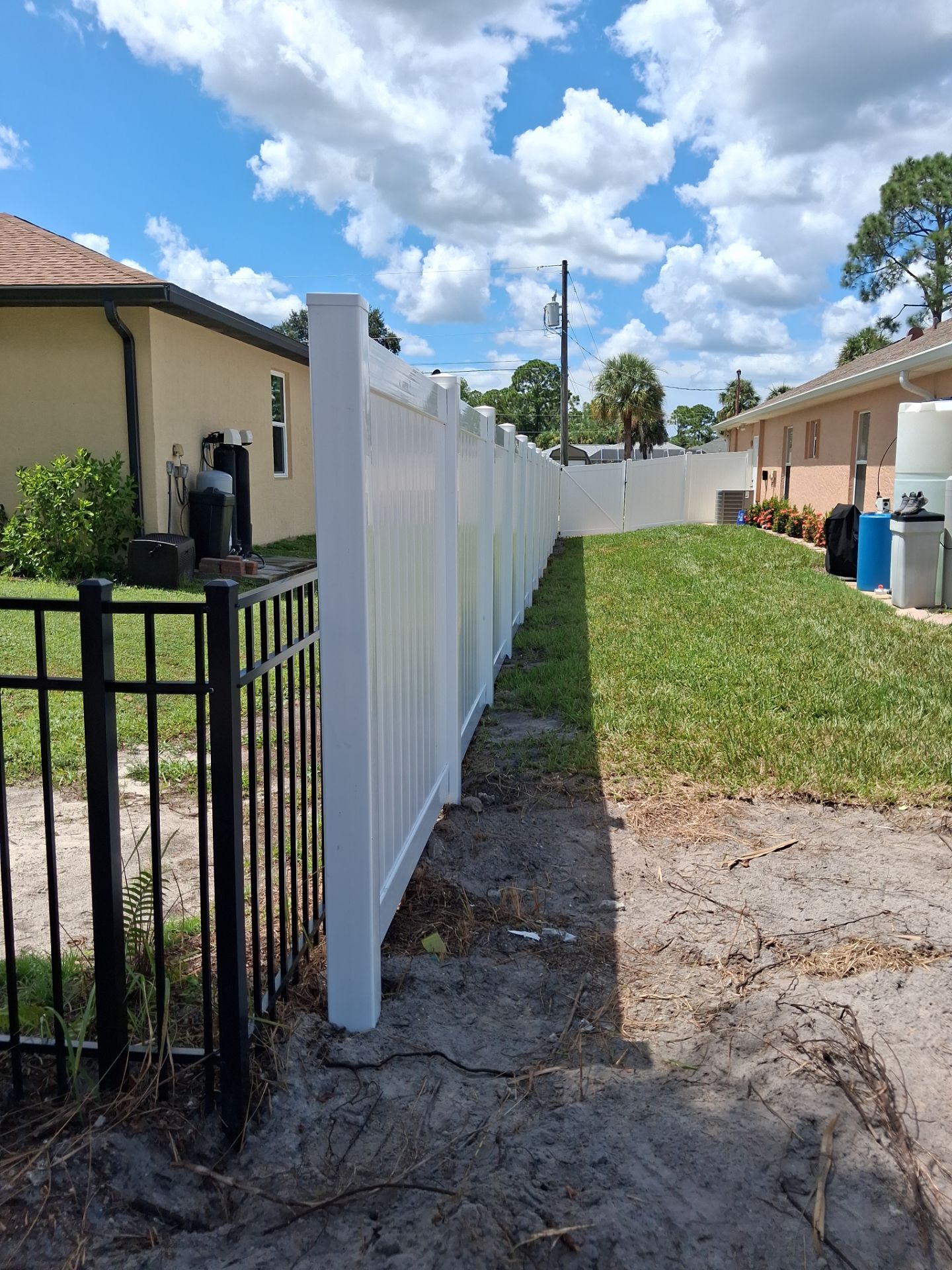White Vinyl Privacy Fence Installation in North Port Florida by True Fence LLC