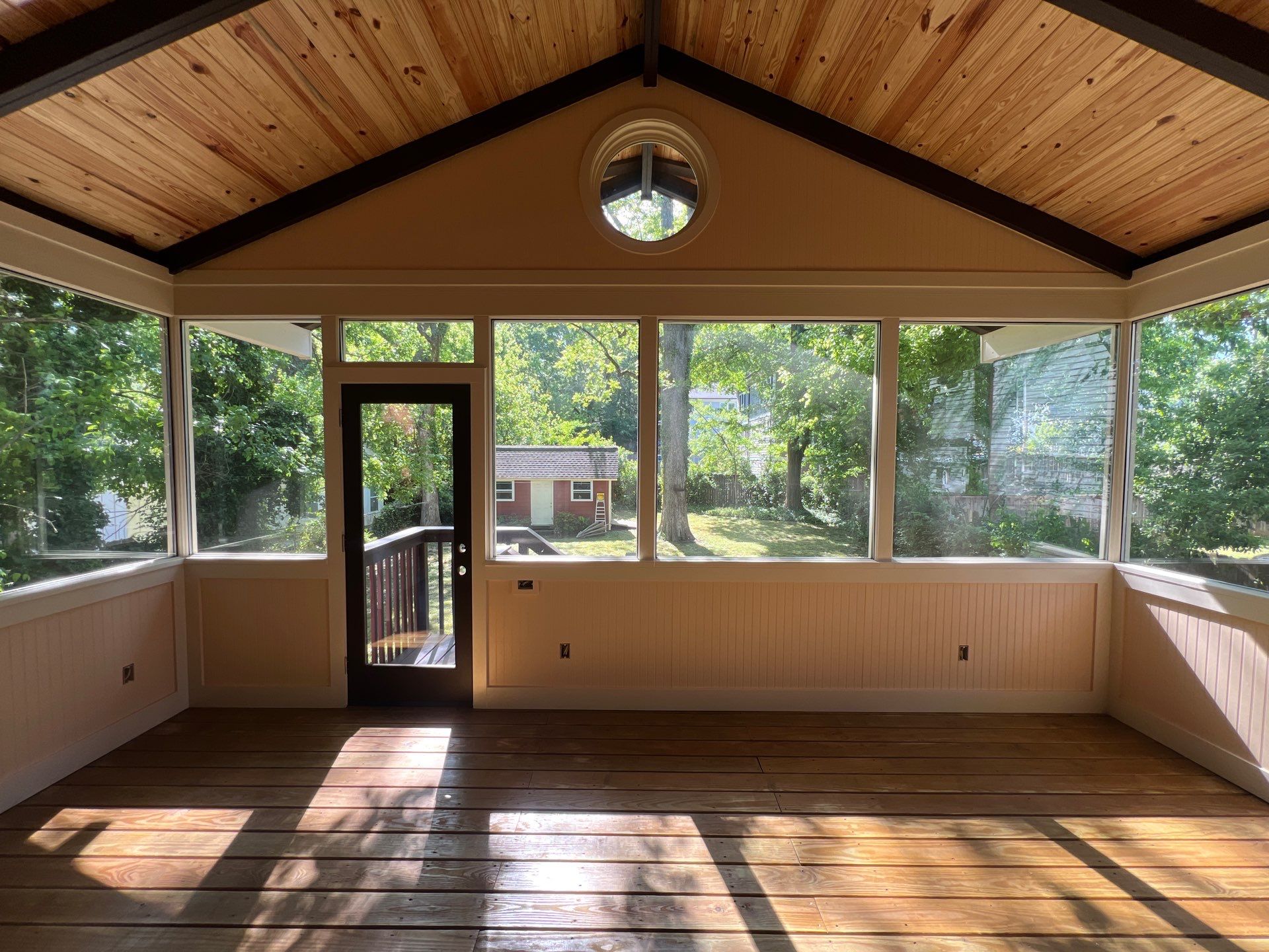 Elevated Screened-In Porch Addition with Vaulted Tongue-and-Groove Ceiling by Swift Home Renovations