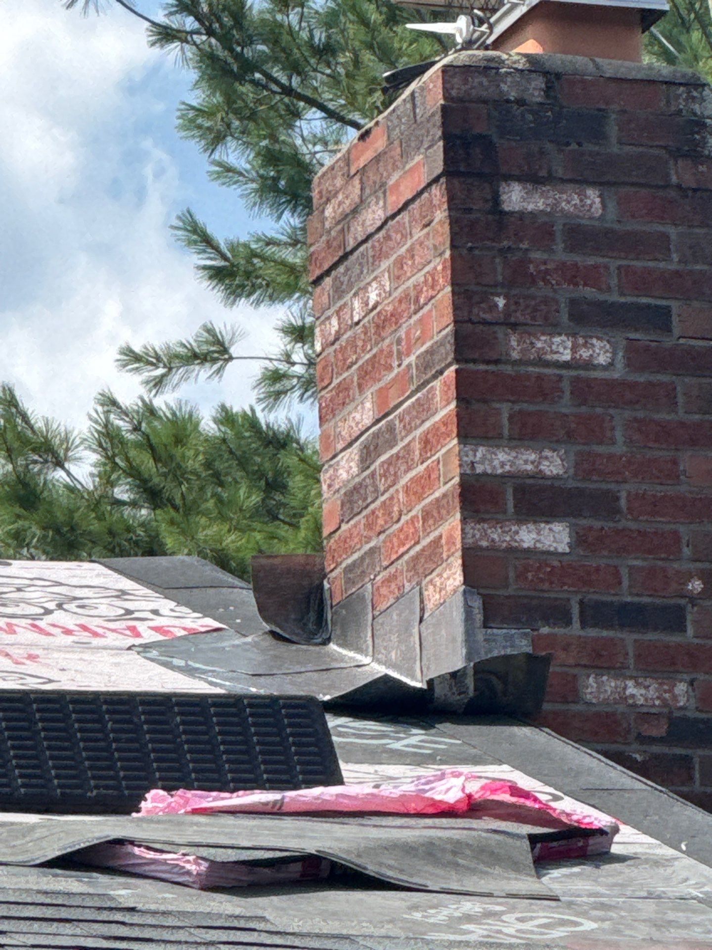 Complete Roof Replacement with Chimney Flashing, Gutter Guard System, and Vinyl Siding Repairs by Mighty Dog Roofing of Greater Middlesex County