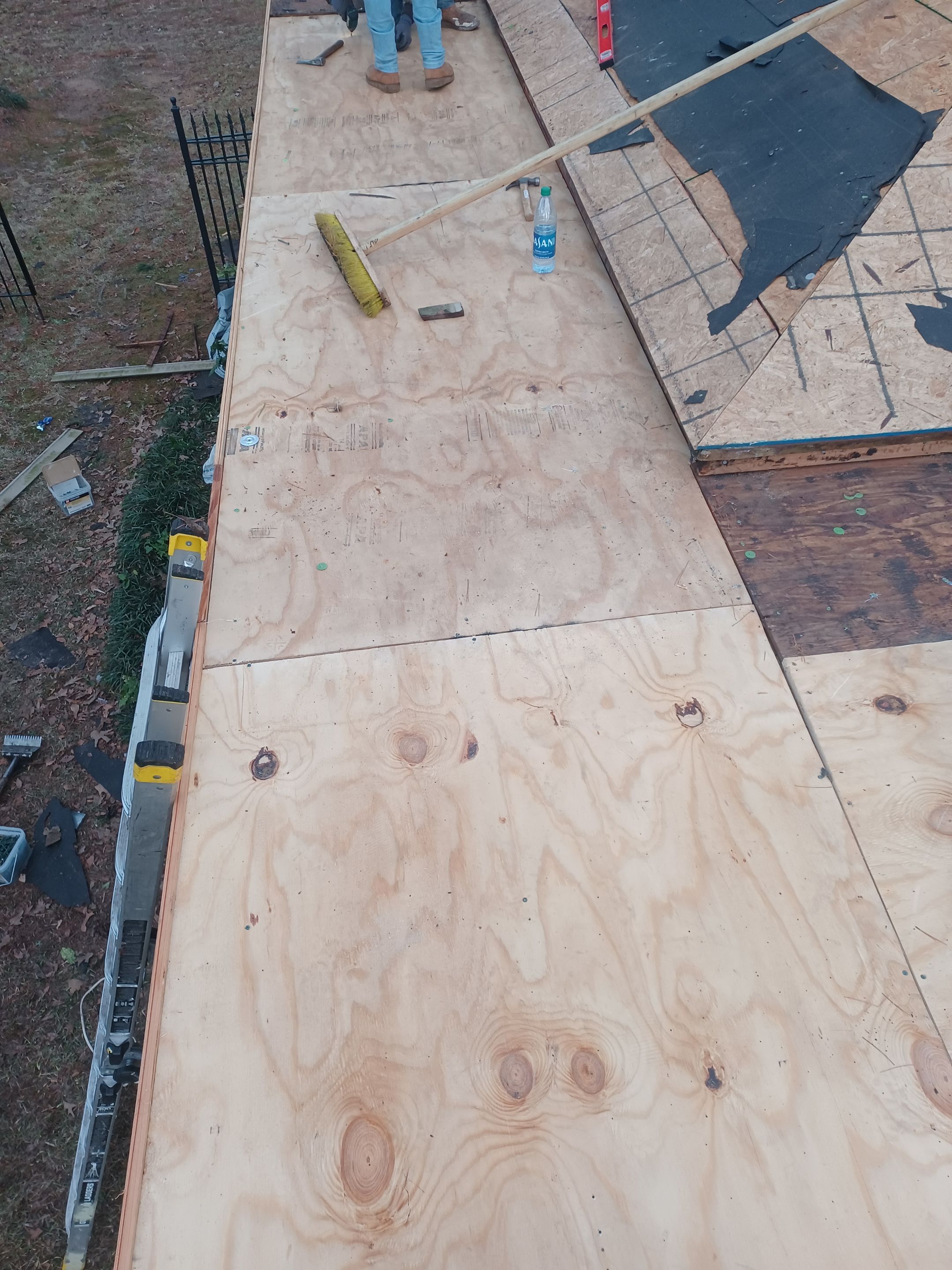 Residential Roofing Installation using PVC membrane and 24 gauge Standing Seam Metal by Hostetler Roofing
