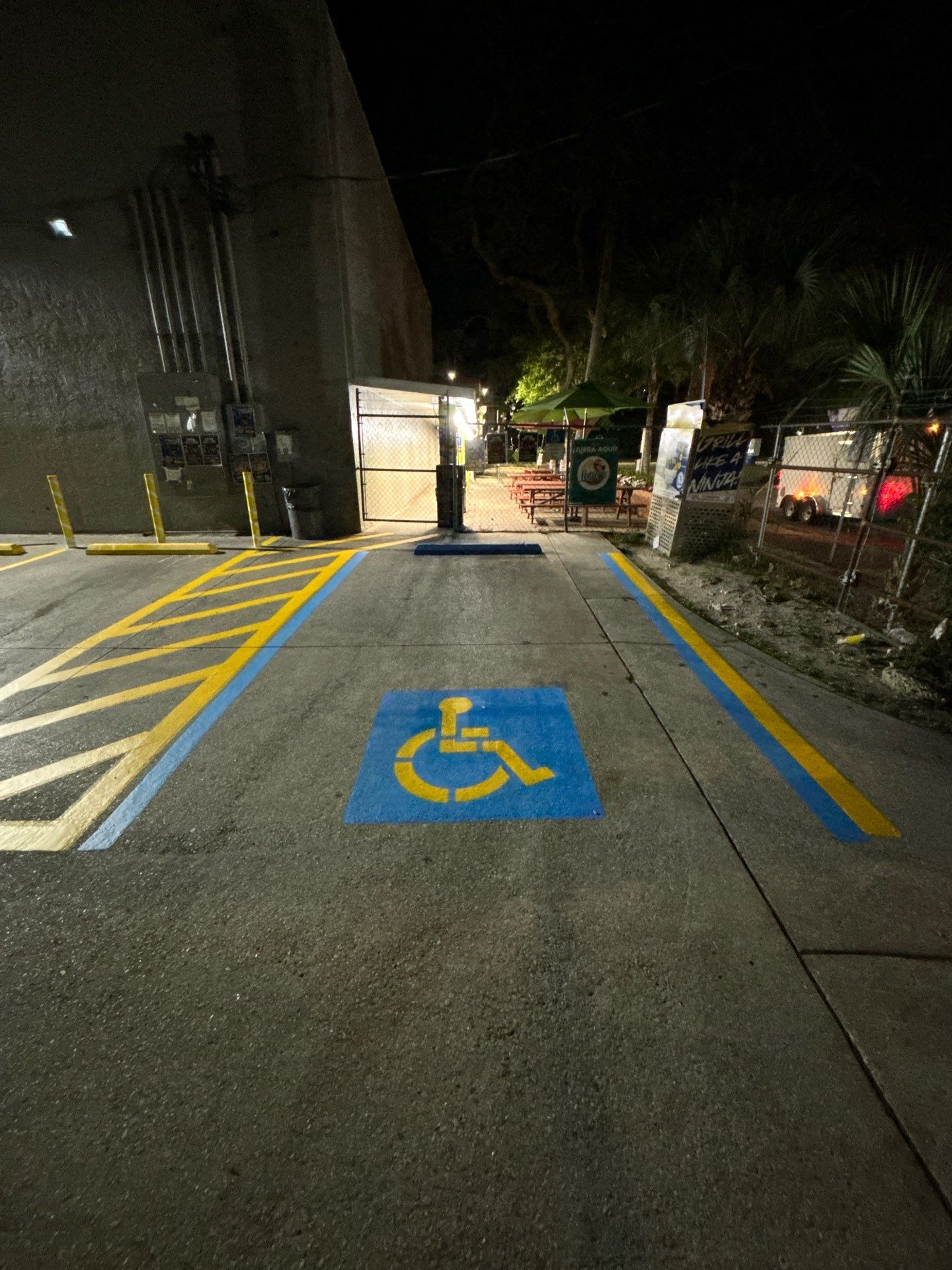 Bollard Installation, Line Striping, & Parking Block Installation at La Primavera Supermarket  by Everline Coatings & Services - Southwest FL