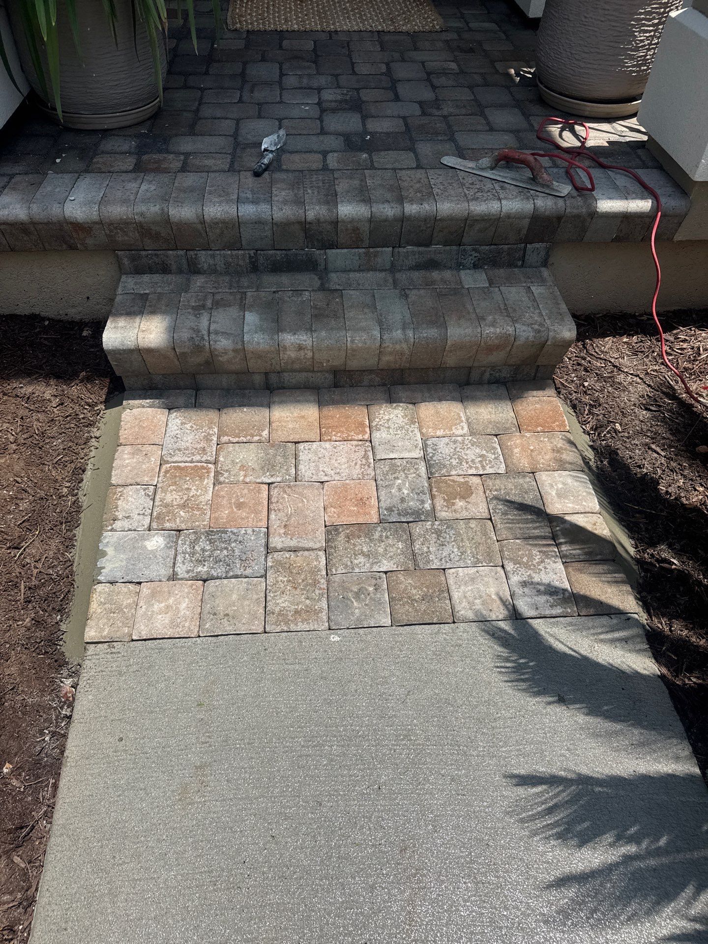 Custom Concrete Driveway and Decorative Paver Installation in Bluffton by Lowcountry Scapes, LLC