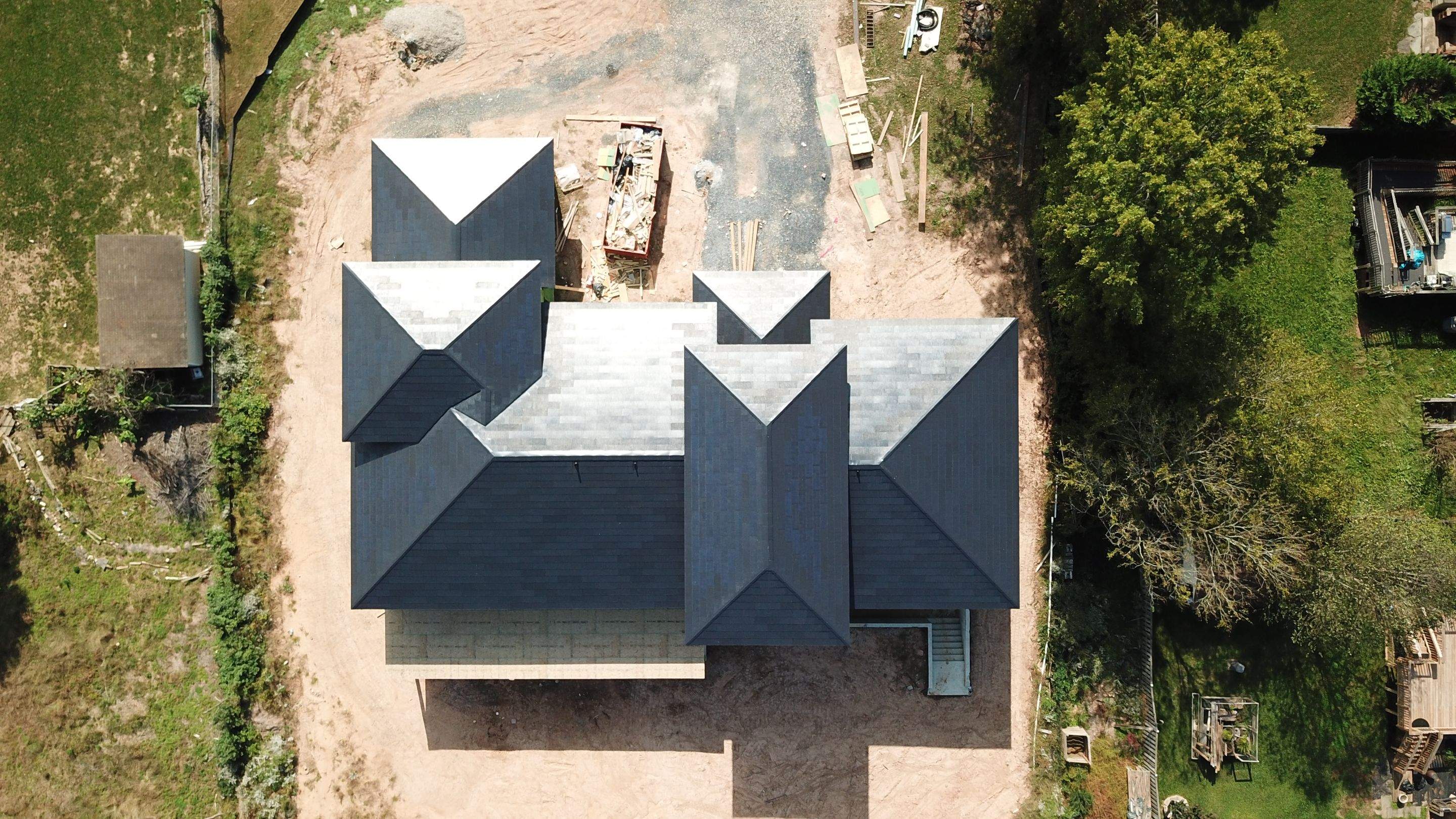 Tesla Solar Roof  using Tesla Solar Roof V3 tiles by American Home Contractors