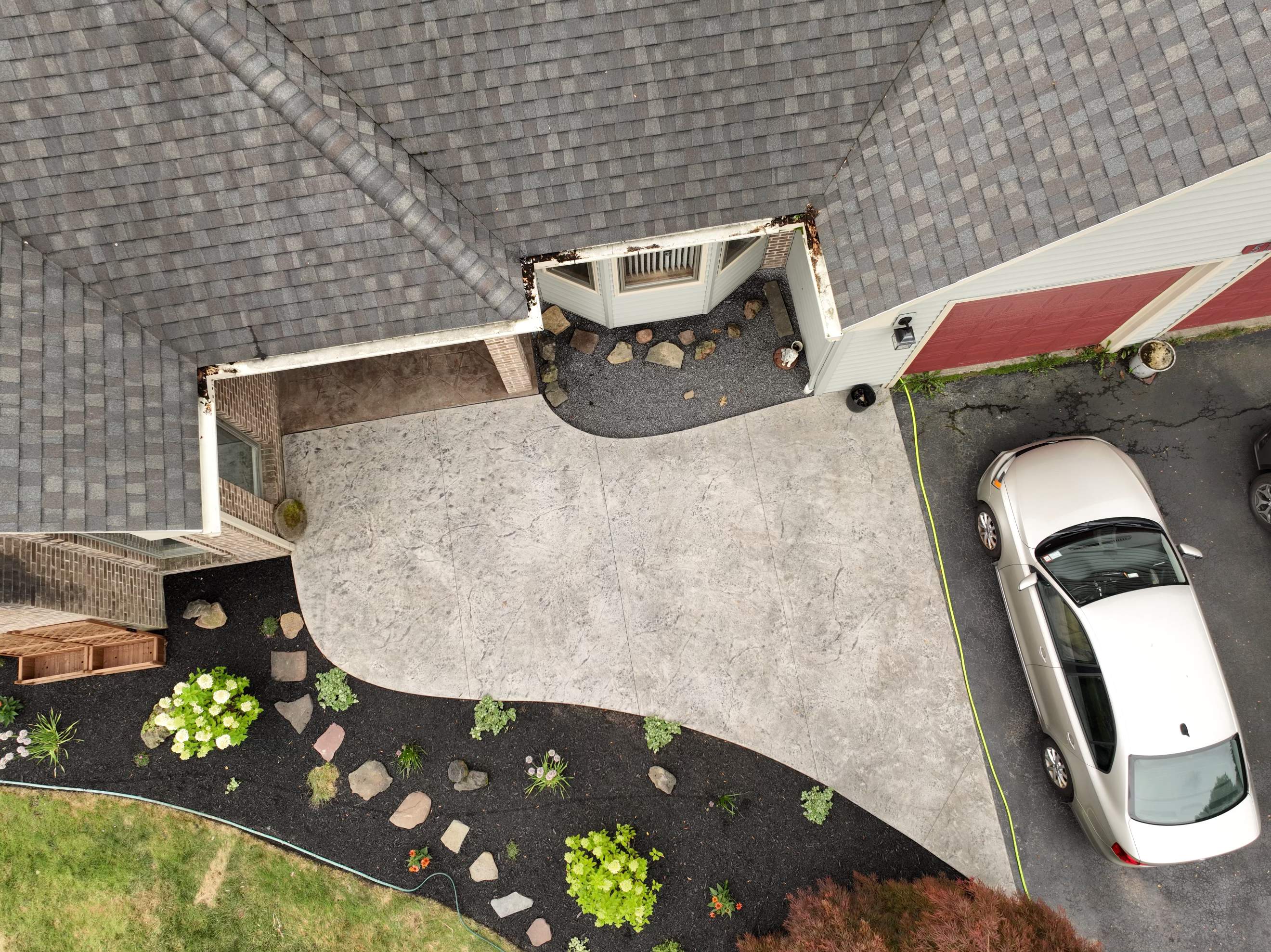 Heavy stone textured stamped concrete patio  by NG Masonry & Construction LLC