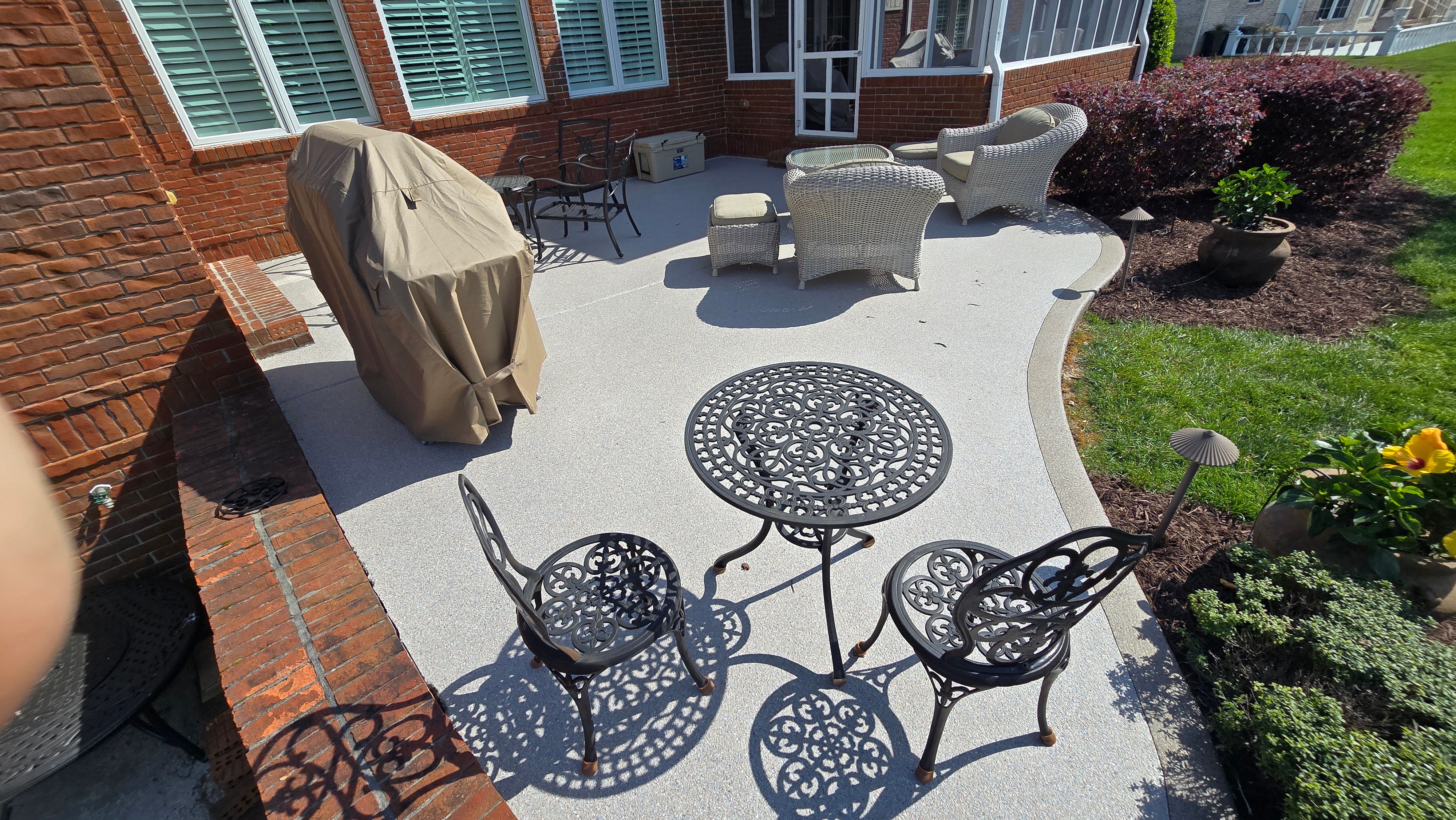 Patio in Pumice with Obsidian Border  by Elite Floor Solutions