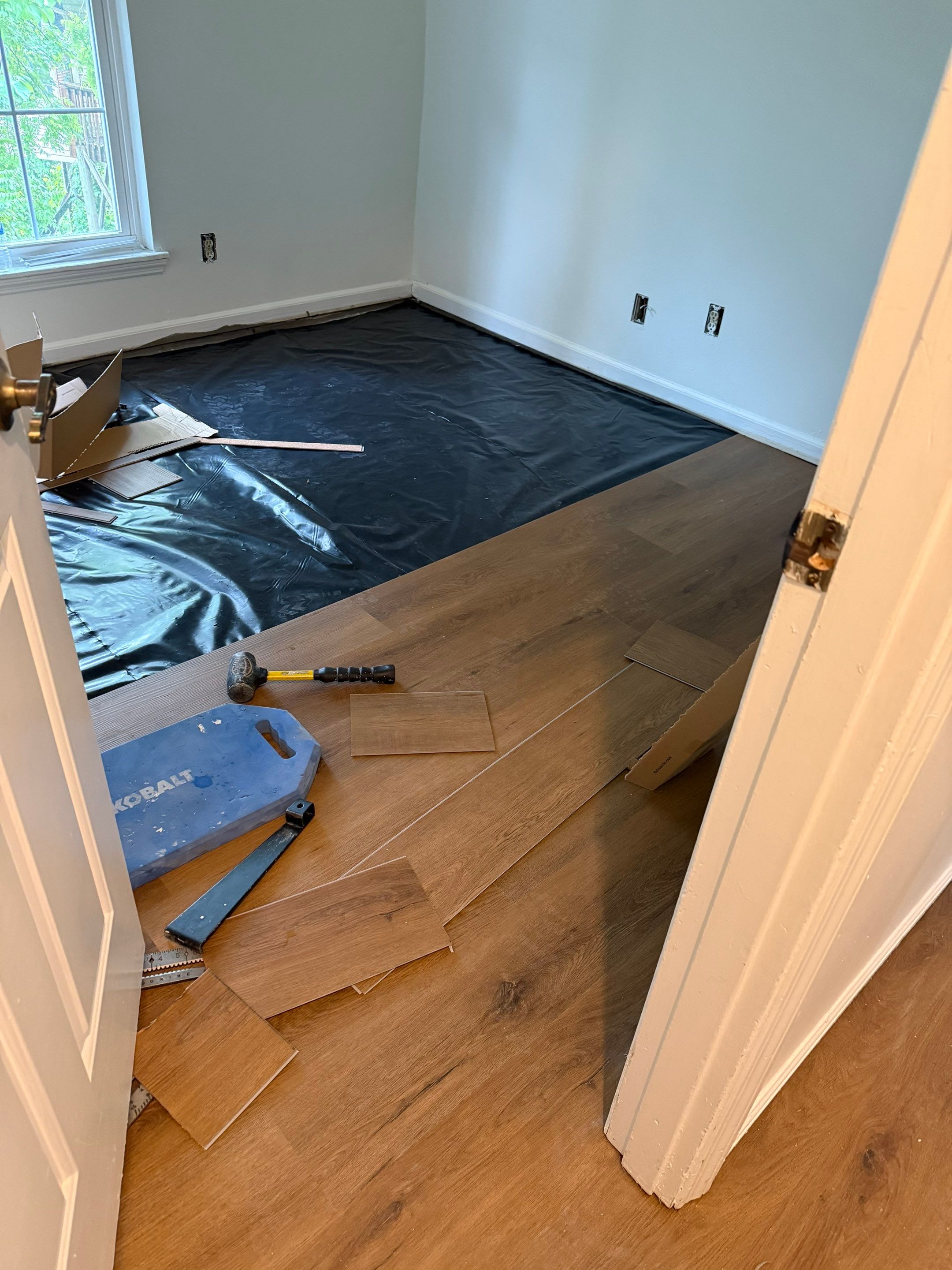Complete Home Remodel Featuring Custom Kitchen and Wood-Look Plank Flooring by MAJO
