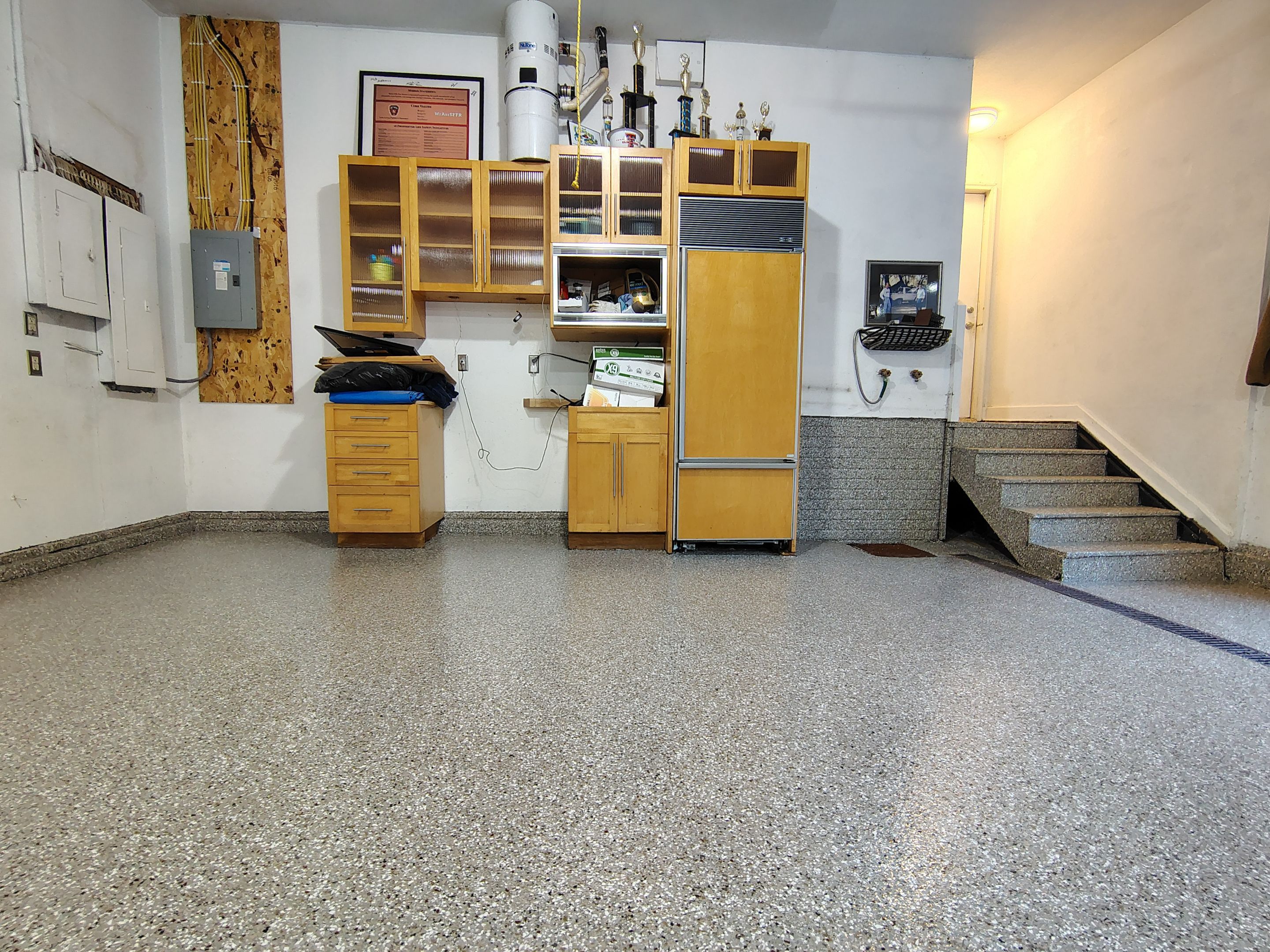 Garage Floor and Entry Step Concrete Coating in Sioux Falls by Select Painting, Coatings & Garage Cabinets