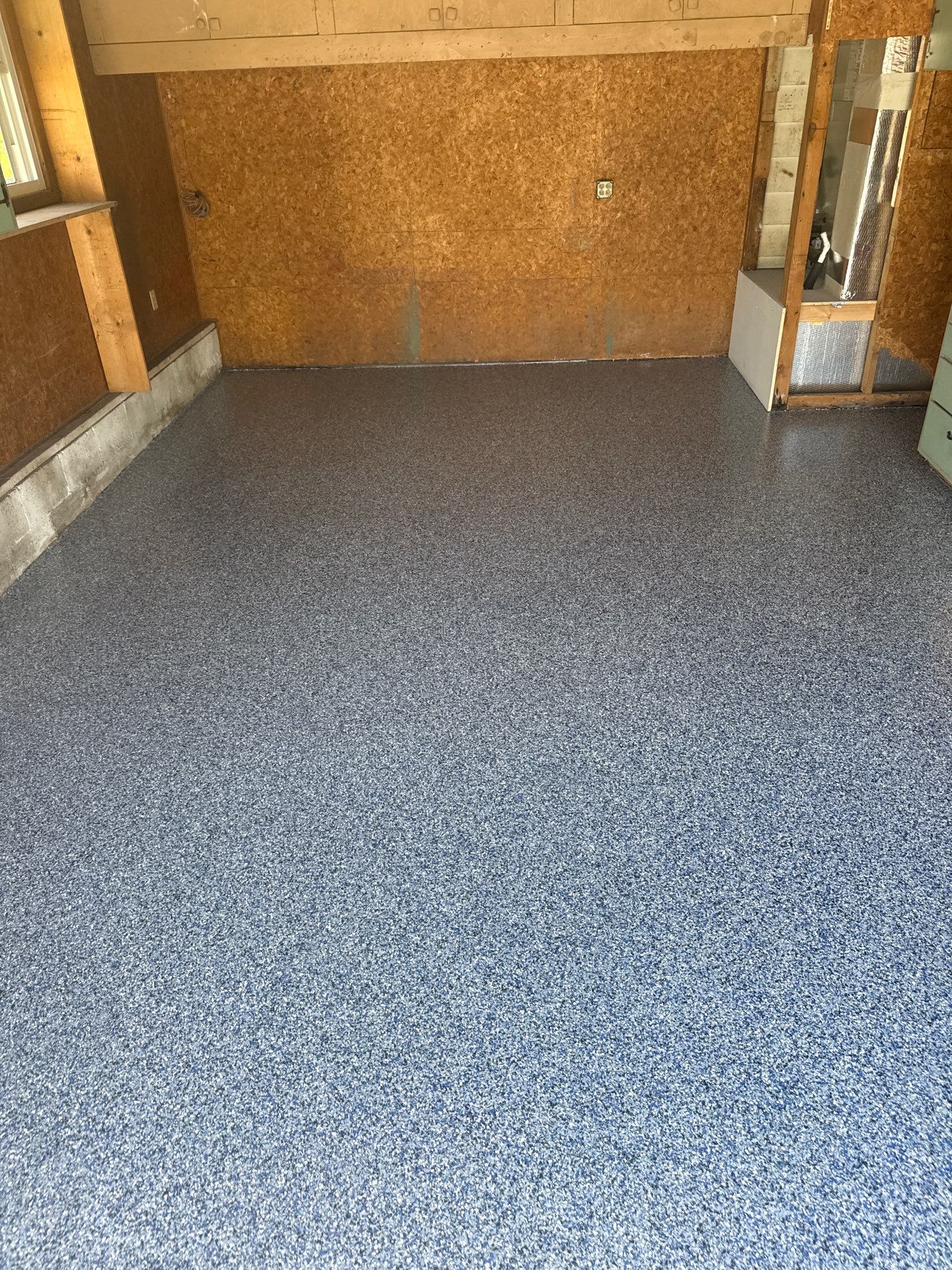 Garage in Midnight by Innovative Concrete Coatings 