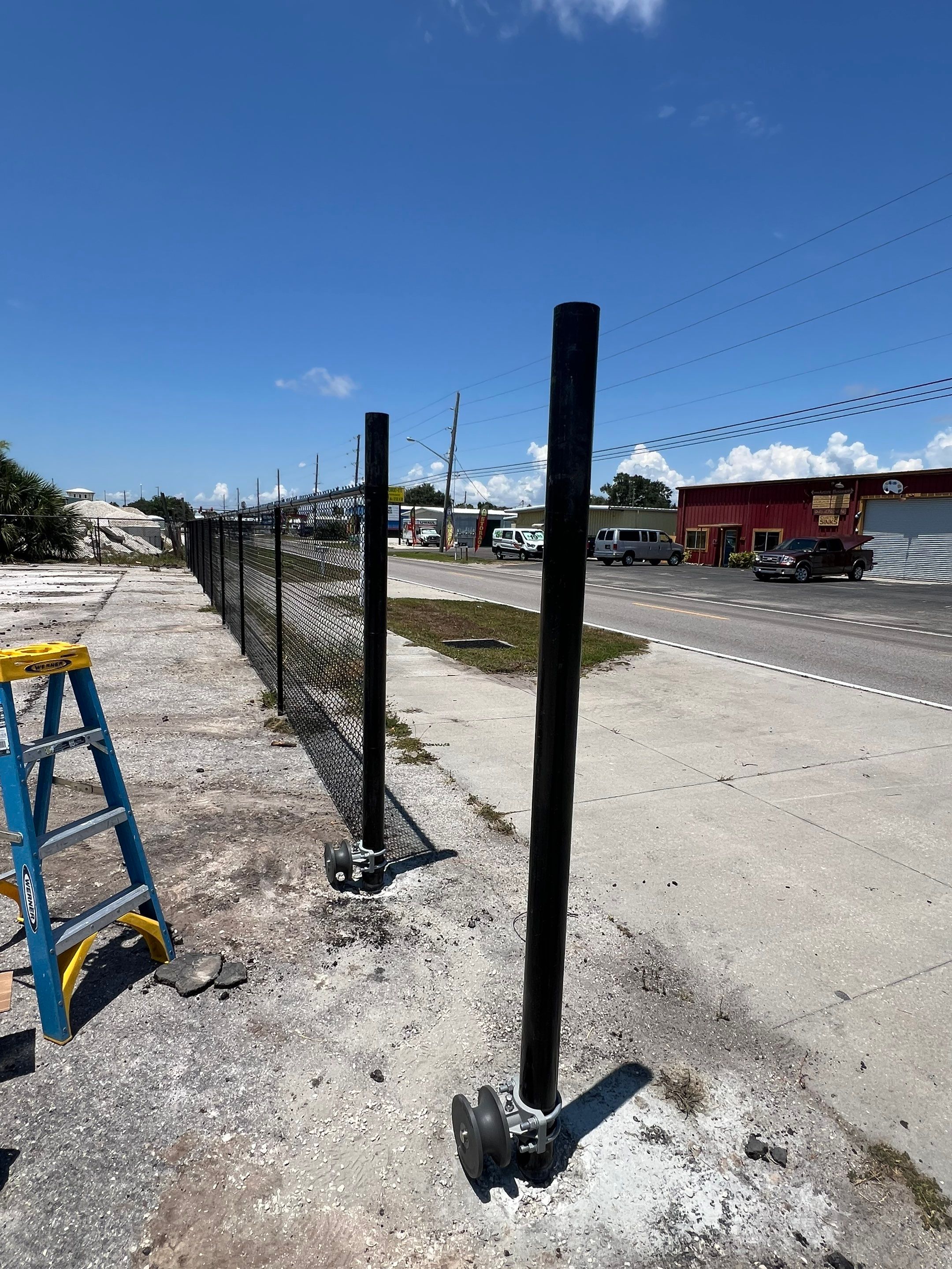Chain-link Fence Installation using 6ft Black Chain Link Fence  by Asap fence and gates, LLC