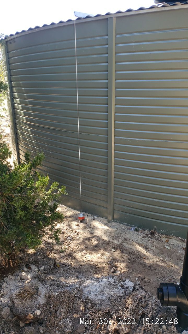 30K gallon mangrove green tank for residential rain water harvesting, Dripping Springs, TX by Hill Country Rain Water