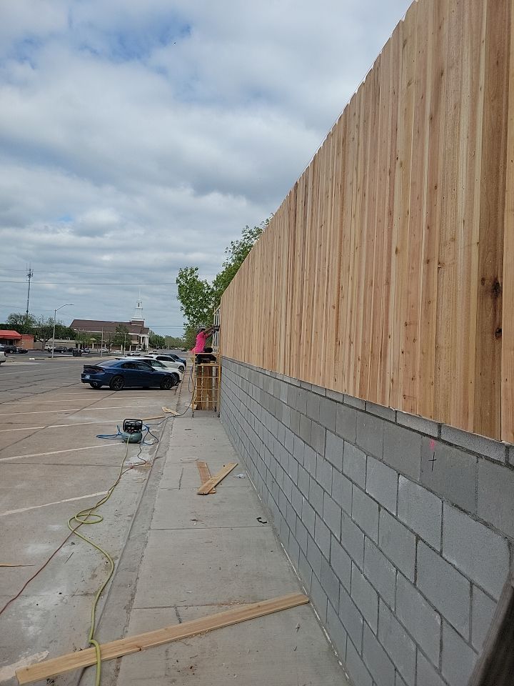 Cedar Fence using Cedar Pickets and Metal Poles by Clays Services Inc