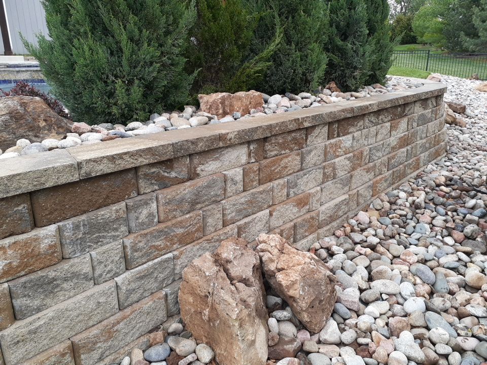 Pool Retaining Wall by LAND ESCAPES LLC
