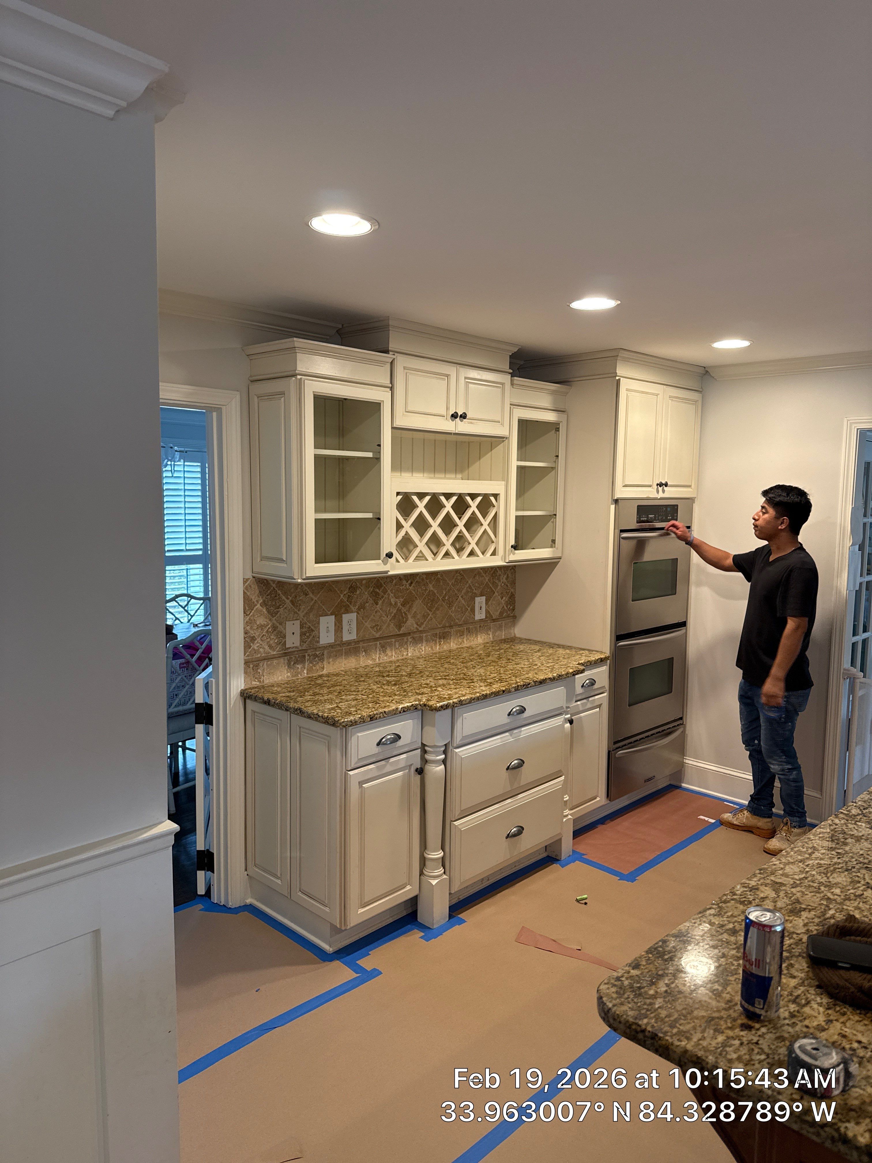 Kitchen Remodel in Dunwoody Featuring White Cabinetry and Blue Island by Heart & Home Kitchen & Bath Remodeling LLC