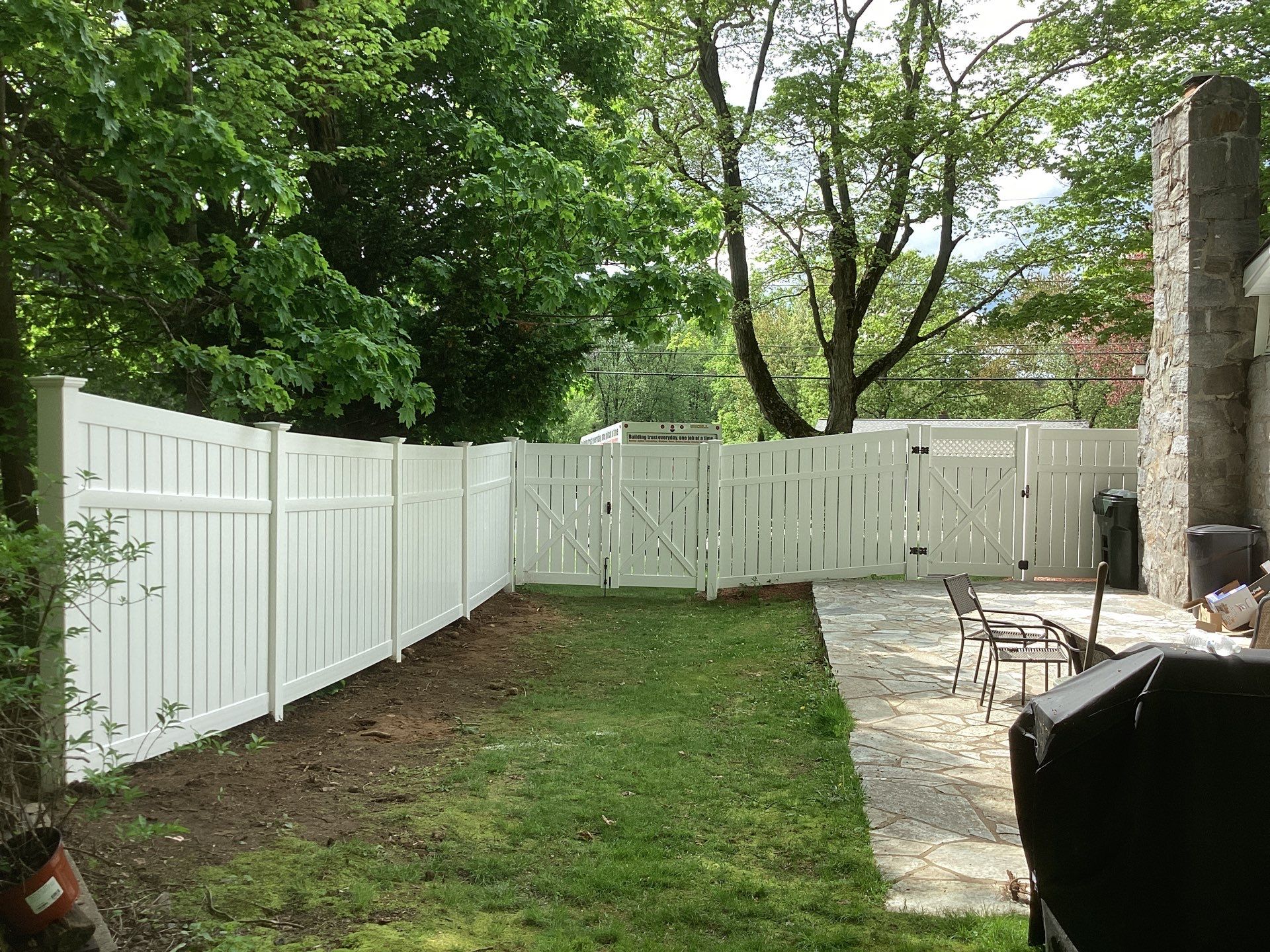 New White Semi privacy Vinyl Fence and matching gates by DiGiorgi Roofing and Siding Inc