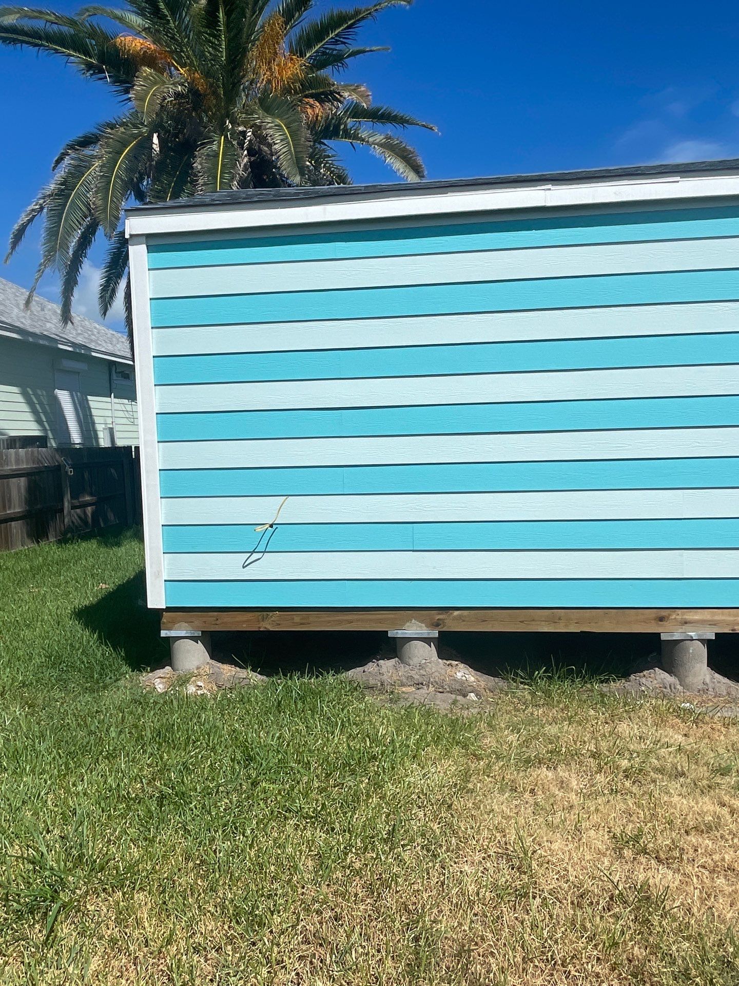 Stripped Beach Bungalow  by Bayfront Roofing and Construction