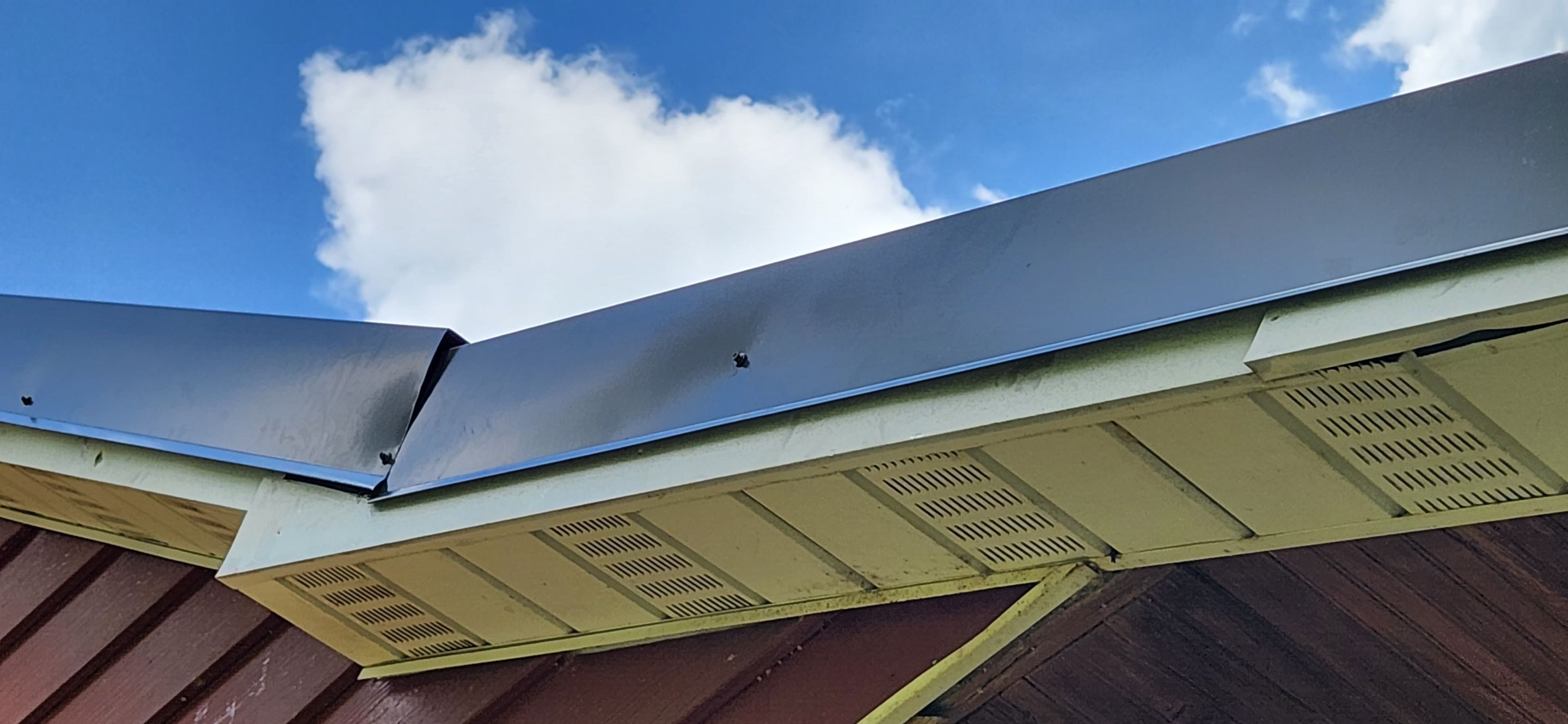 Residential Roofing Installation using 26 Gauge Colored Panels by Hostetler Roofing