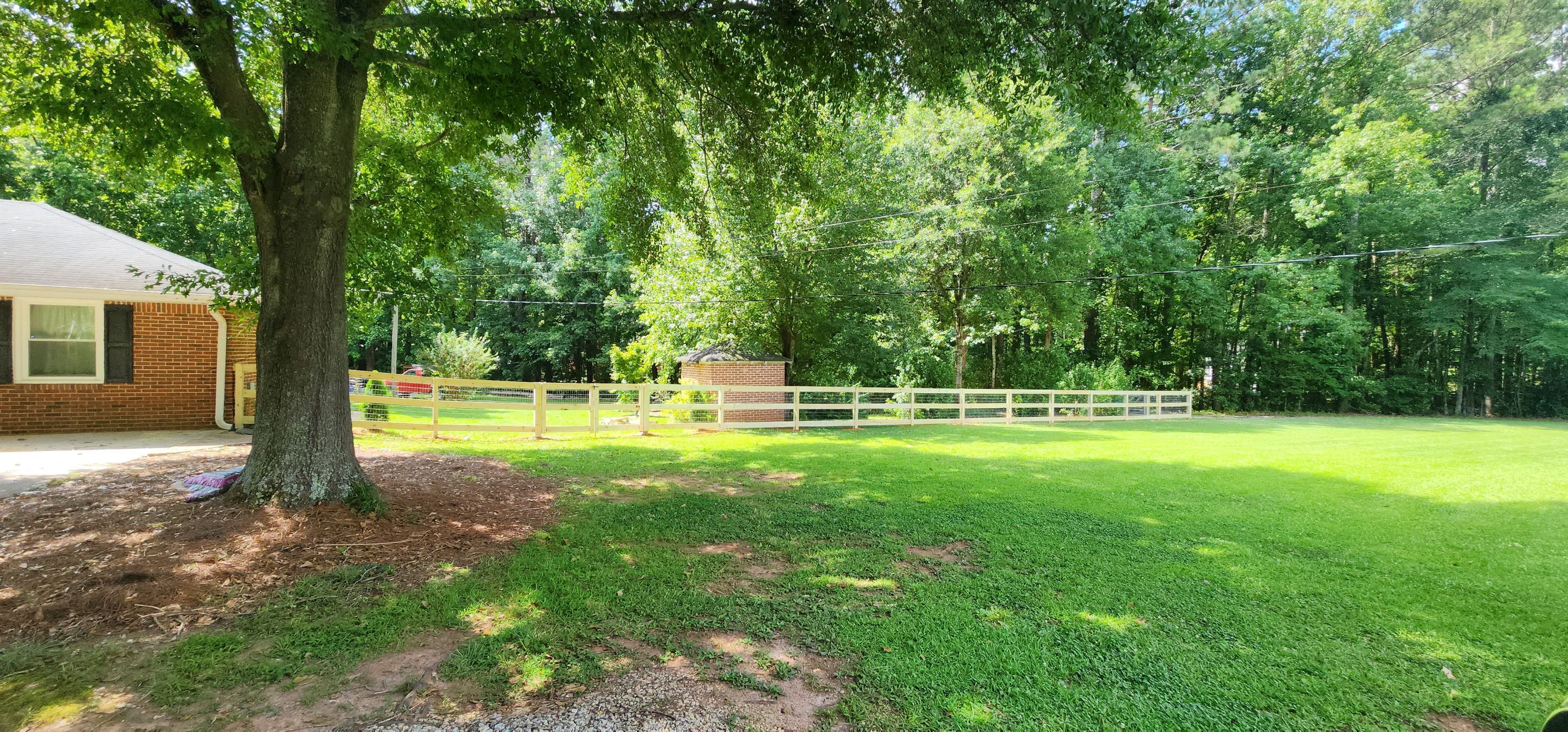 Fence Installation of 3 Rail Ranch with Wire Backing by Titans of Timber Fence & Stain