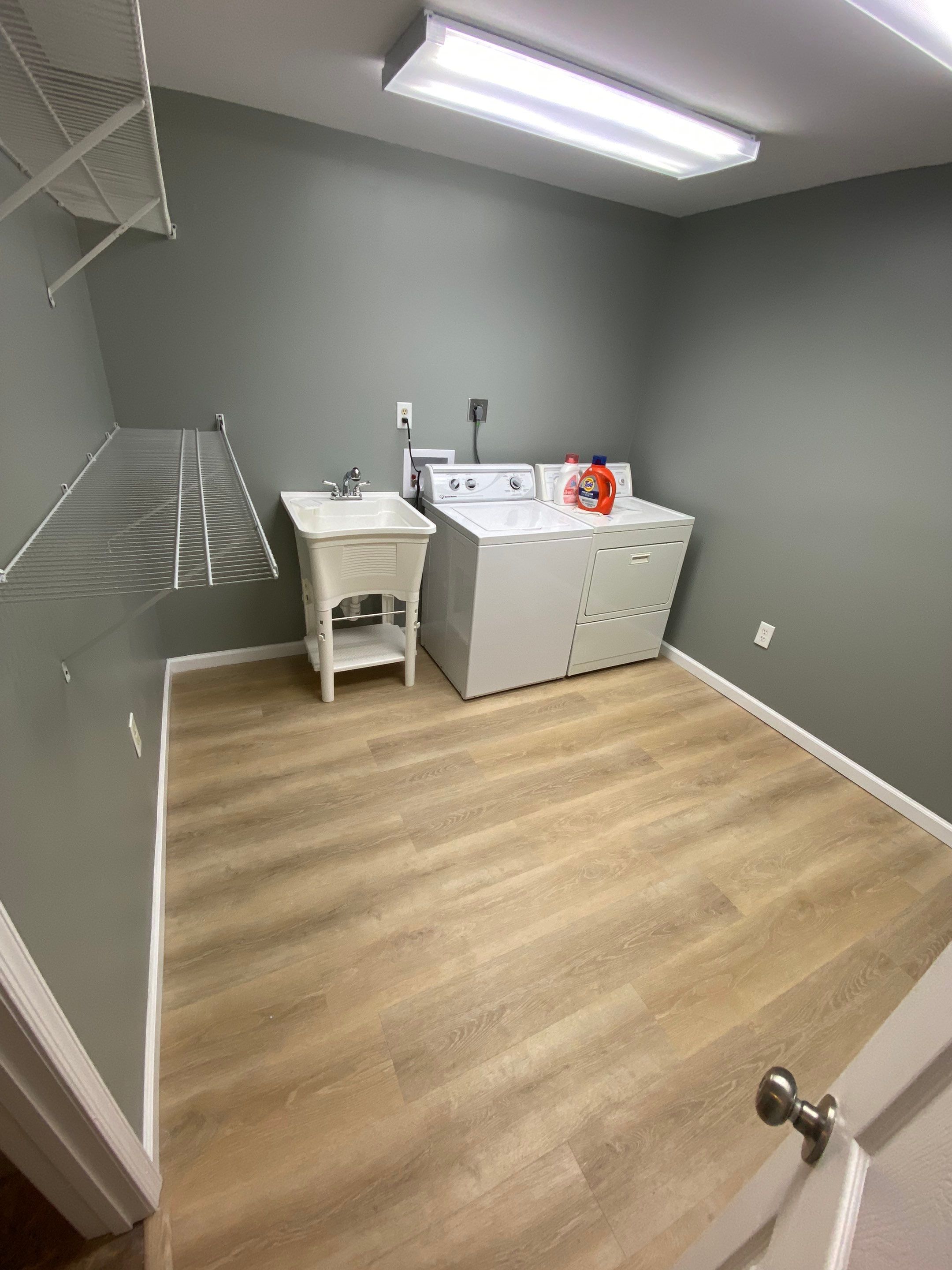 Laundry Room Redmodel using Lifeproof Luxury Vinyl Plank Flooring by The Smet Companies, LLC