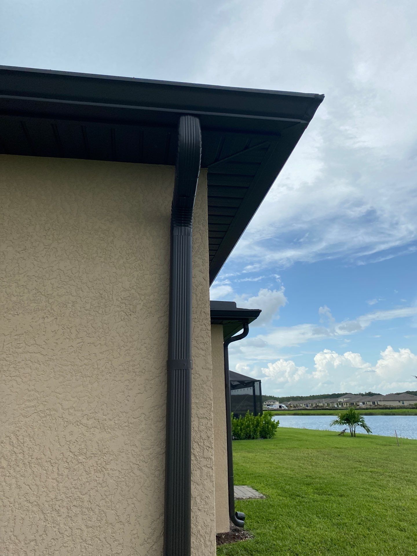 Brown Seamless Gutters for Homes in Fort Myers by Gutter Professors