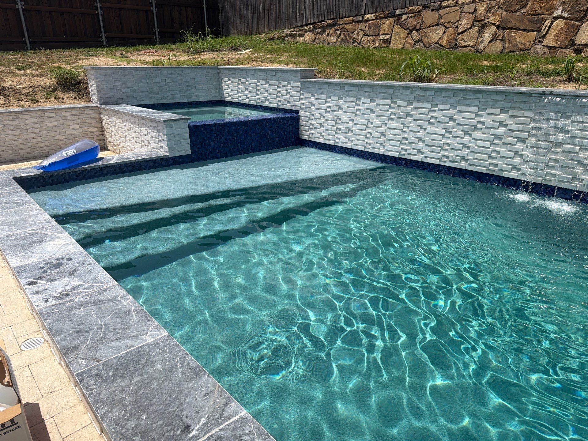 Geometric Pool with Raised Spa and Tile Spillway by Pinnacle Pools and Spas - DFW