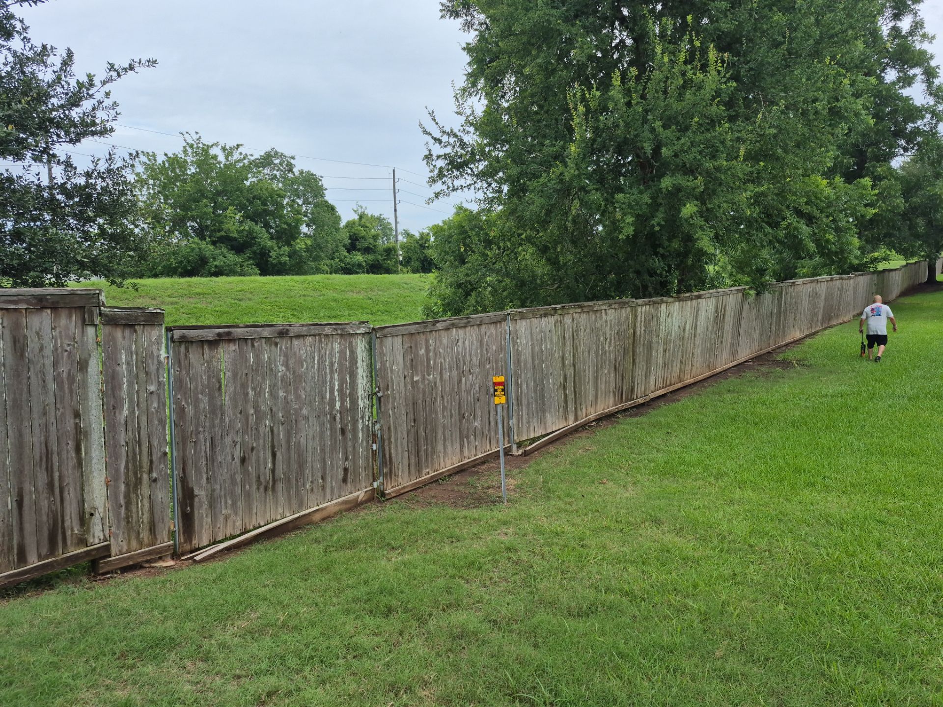 Wood Fence Installation for HOA by Tim's Fences