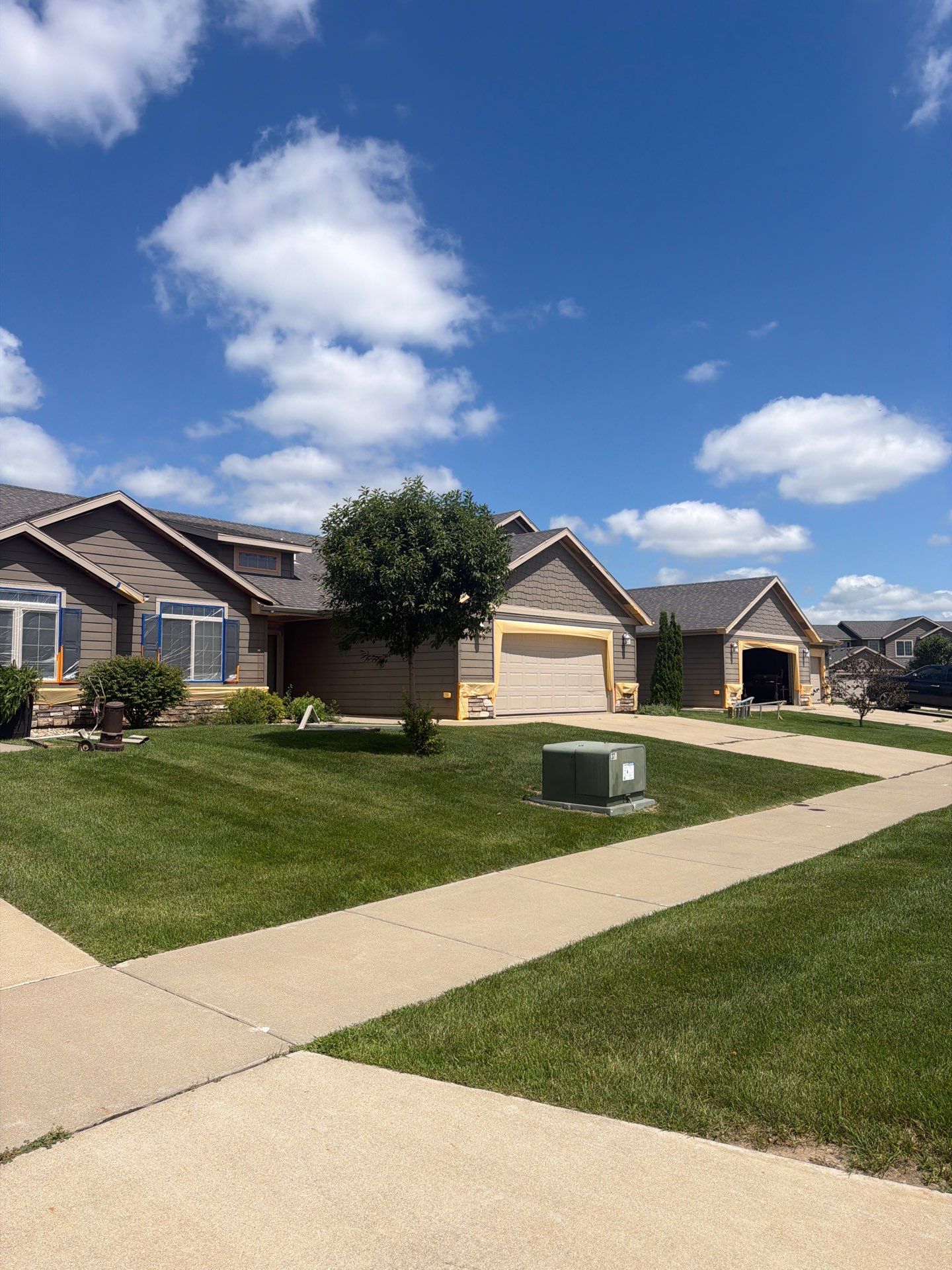 Exterior Painting for Multi-Unit Townhomes in Sioux Falls by Select Painting, Coatings & Garage Cabinets