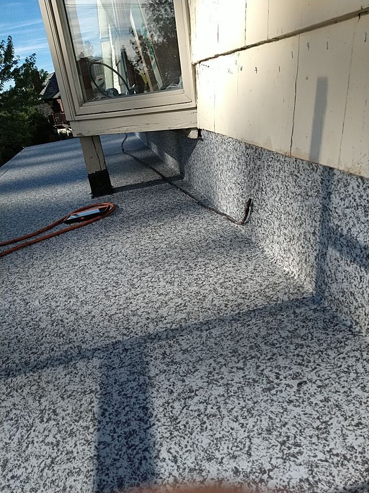 Residential Roofing Installation, Dec-tek walk-out porch roof, siding on garage by Absolute Roofing and Construction